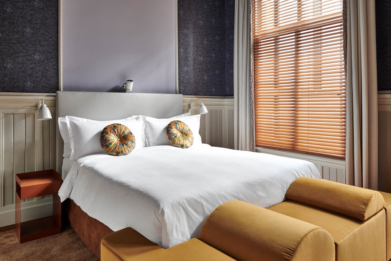 bedroom suite with yellow couch