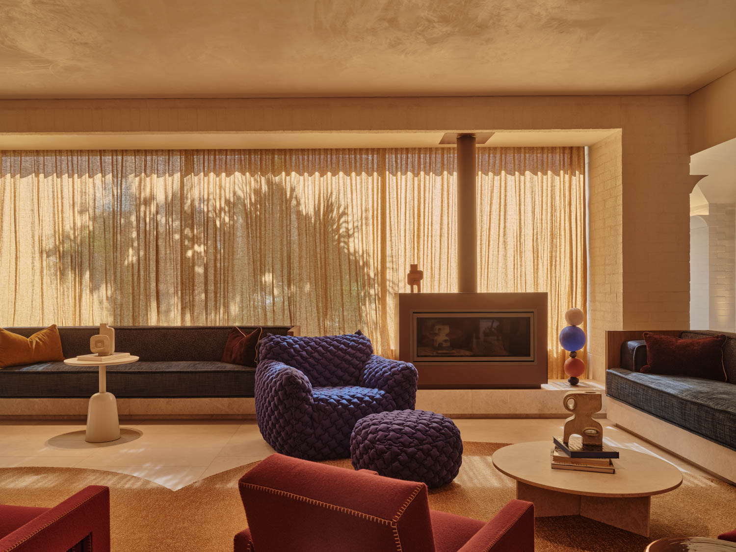 lobby with gauzy white curtains and seating
