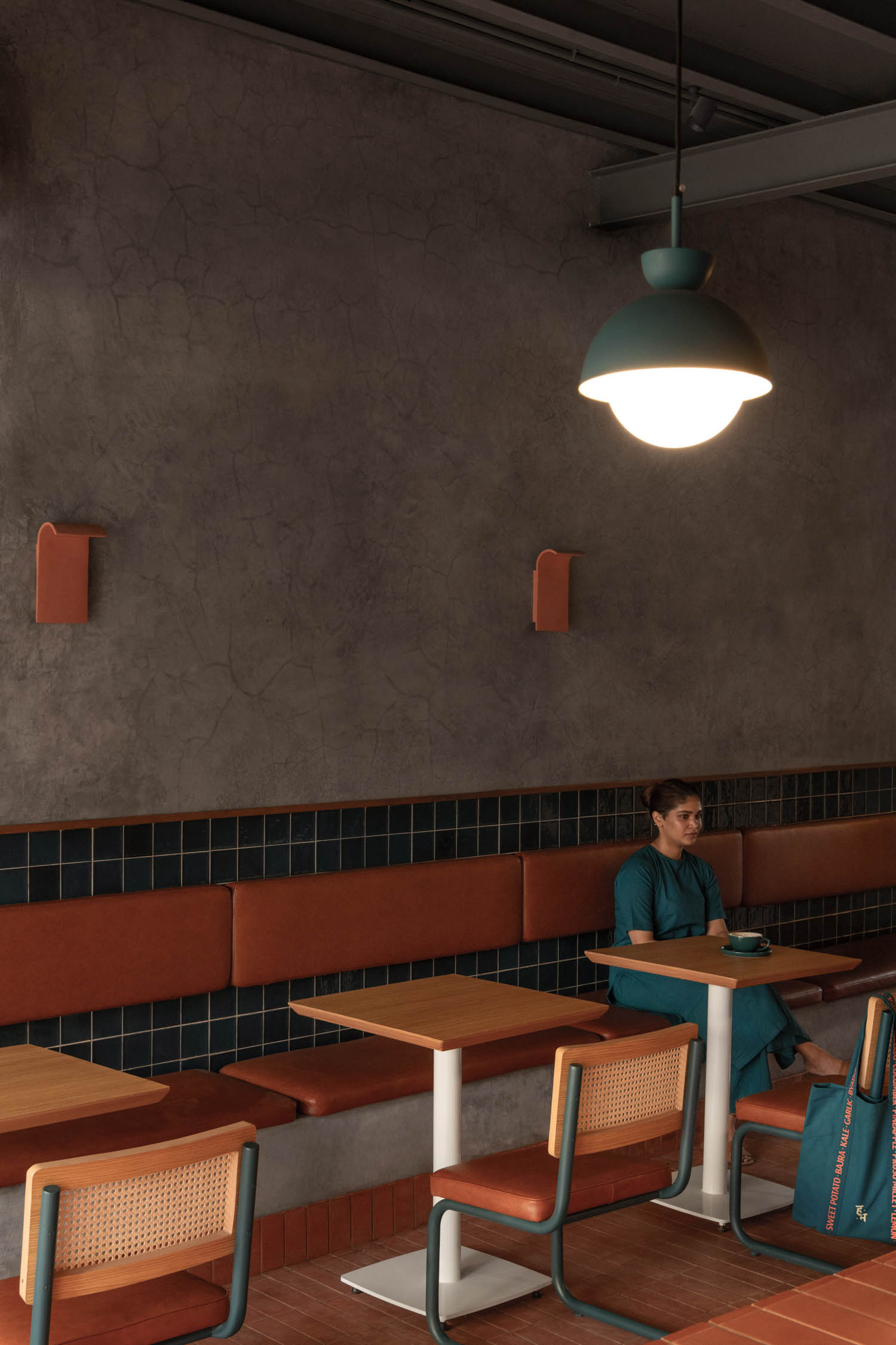 woman sitting at booth