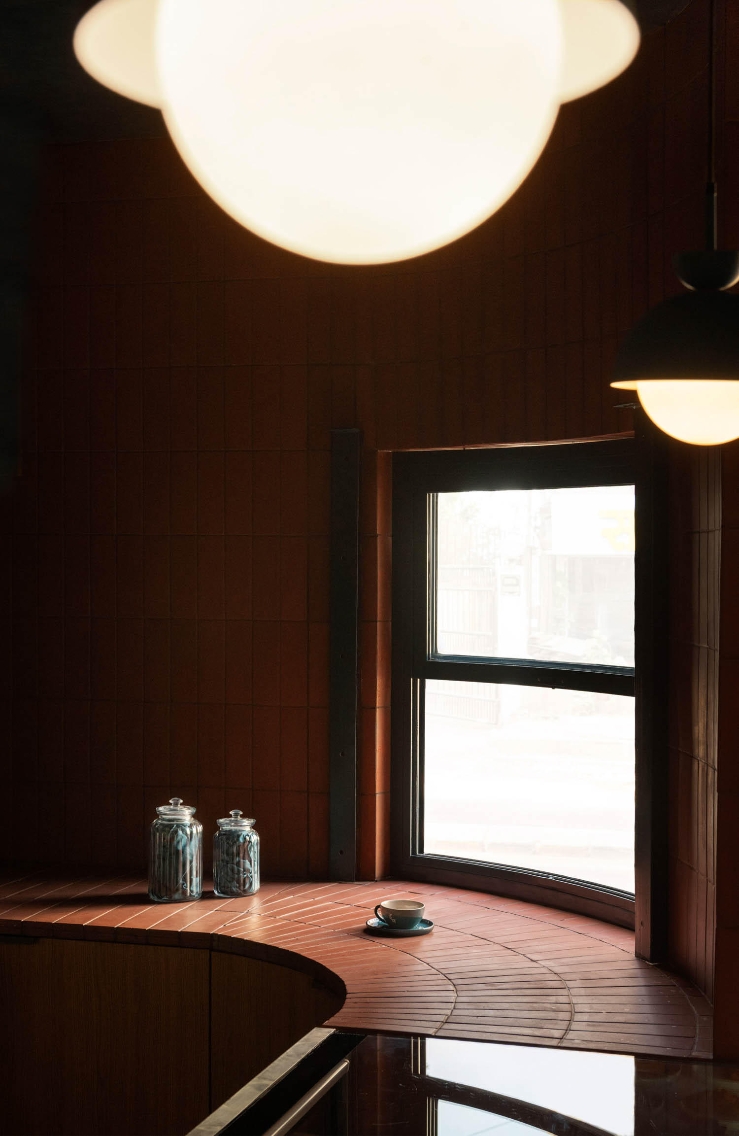 curved area of the coffee shop with terracotta brick