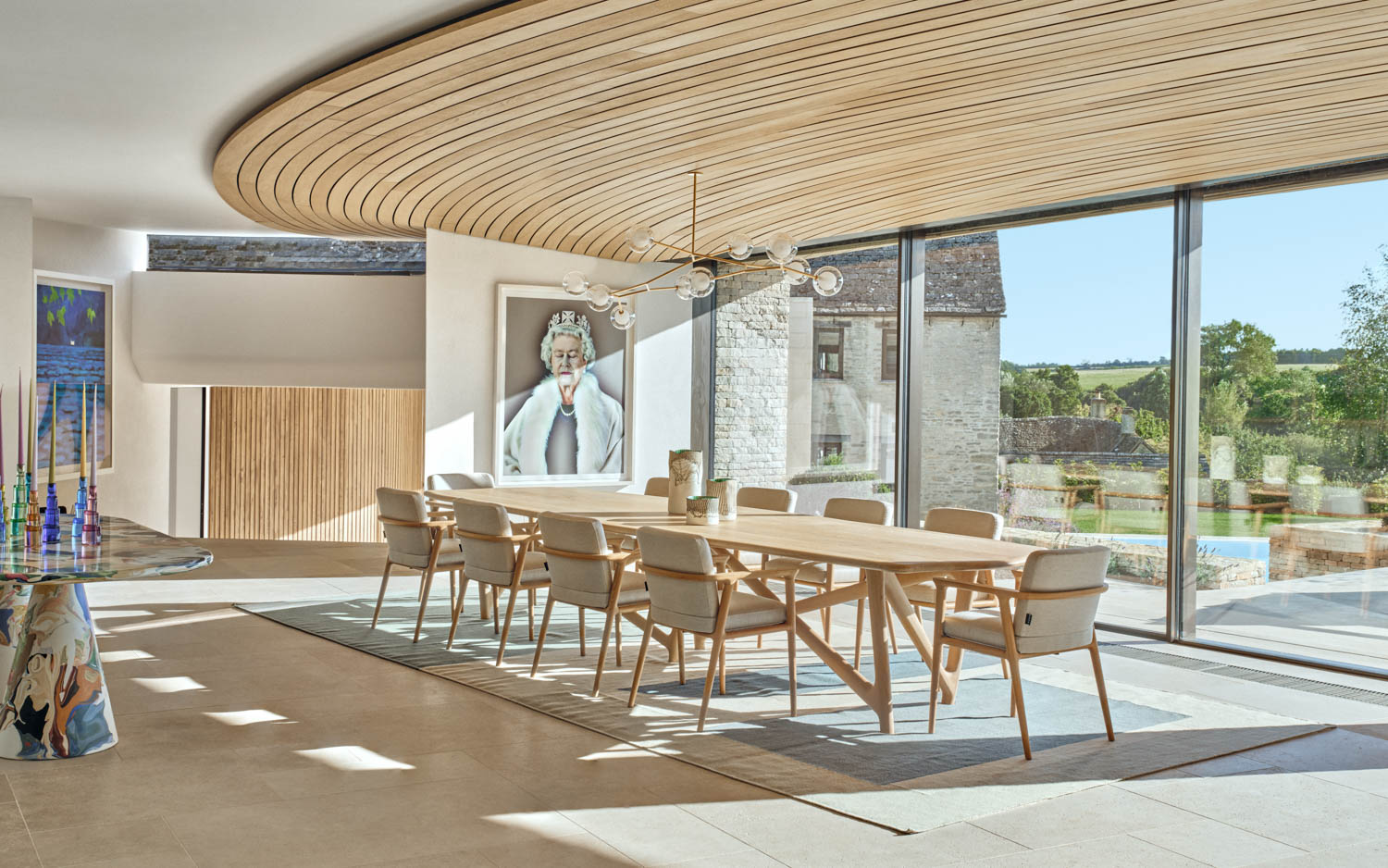 dining room with a portrait of Queen Elizabeth II on wall
