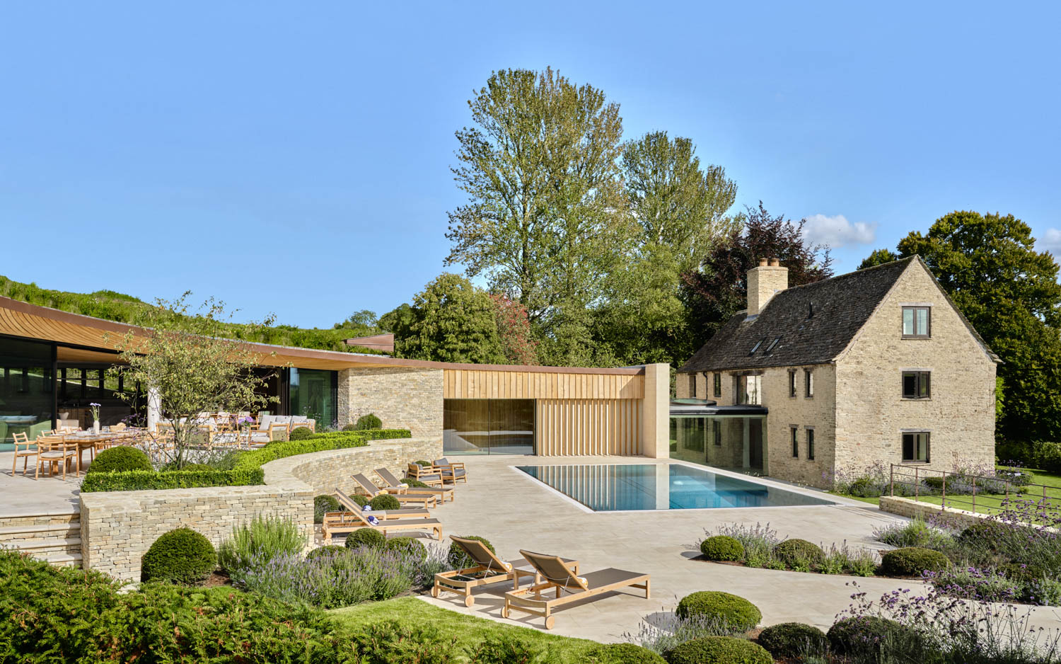 exterior facade of home with added pool and courtyard