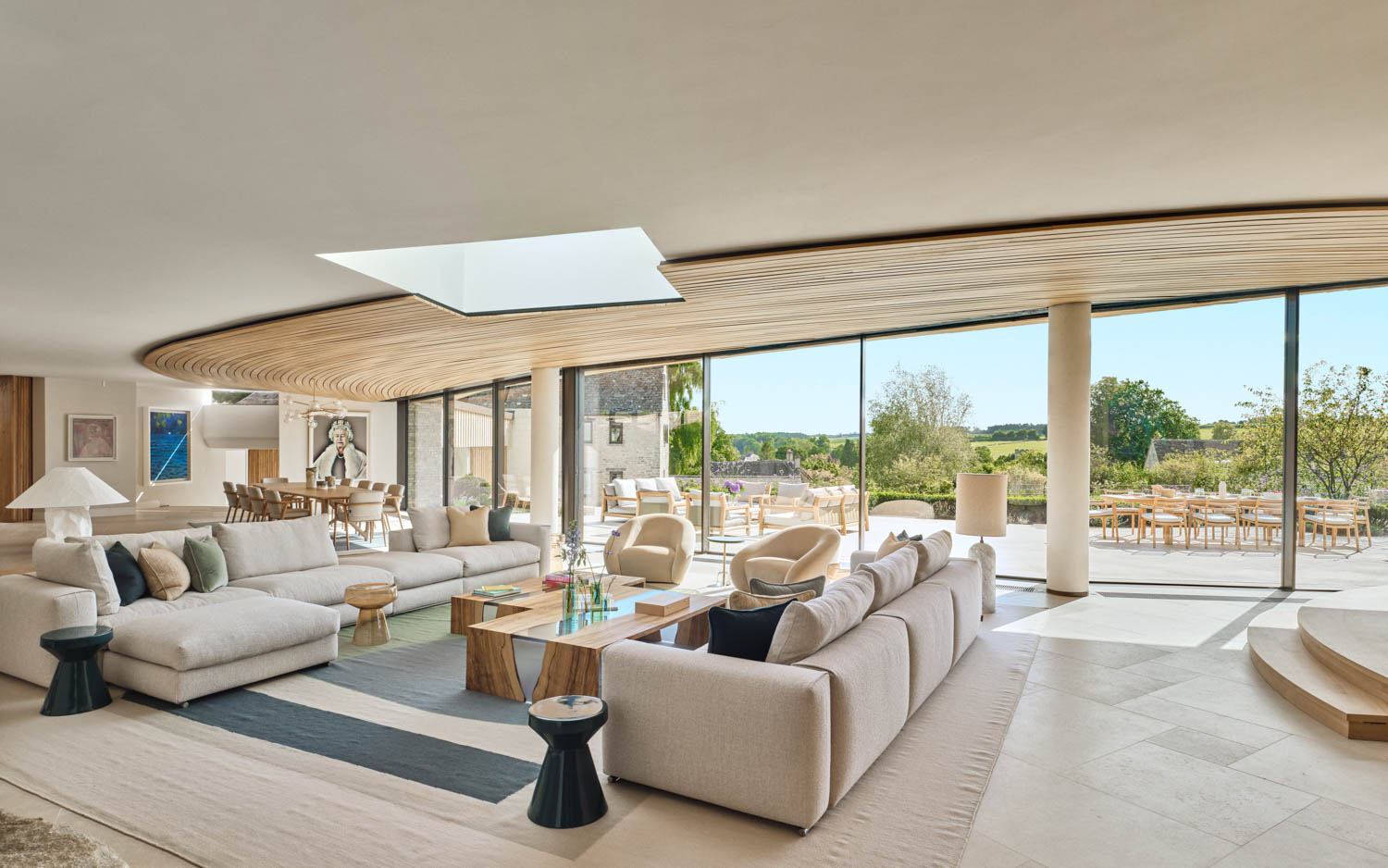 living room with neutral couches and view to outdoors