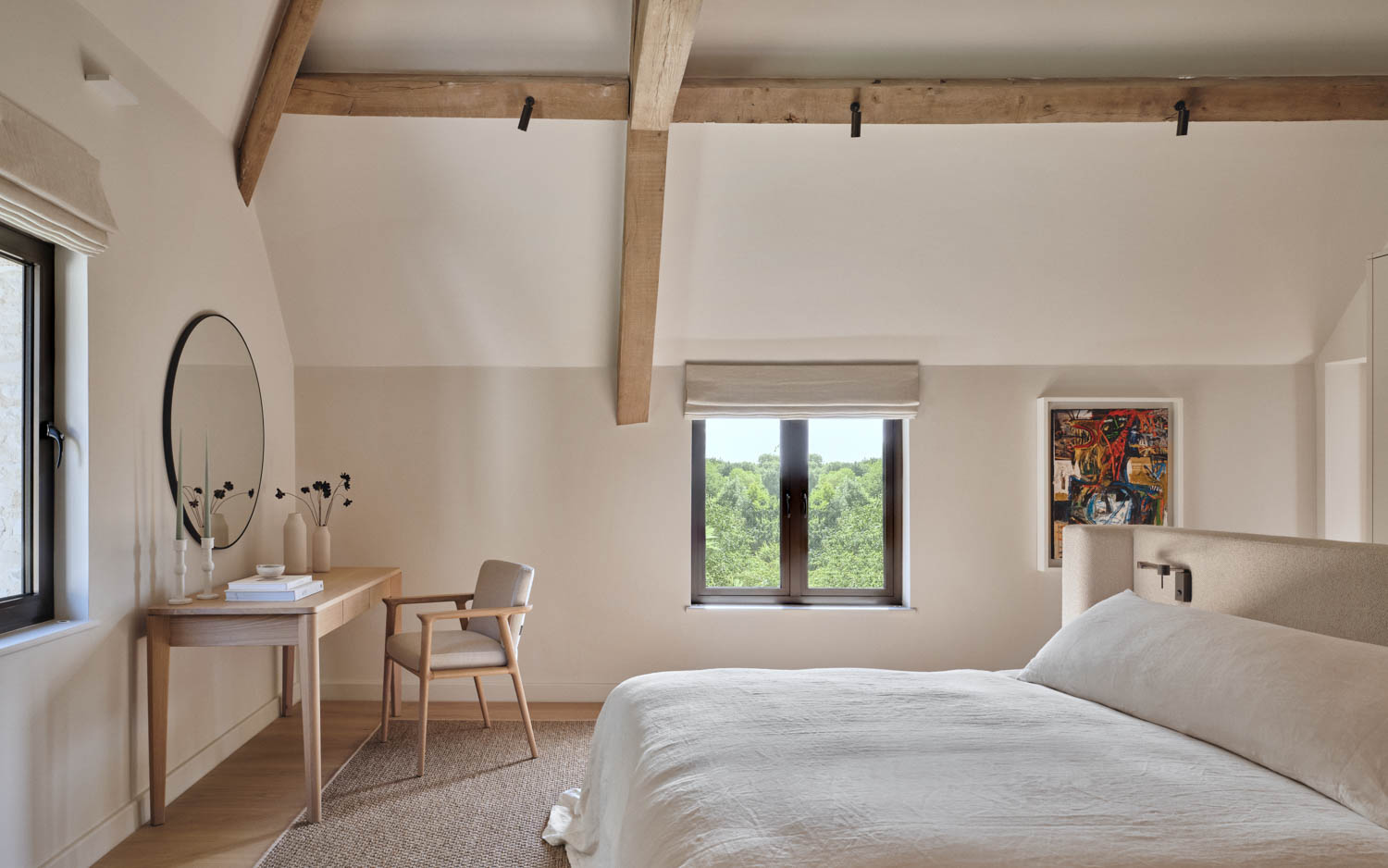 bedroom with high beam ceiling and minimalist study area