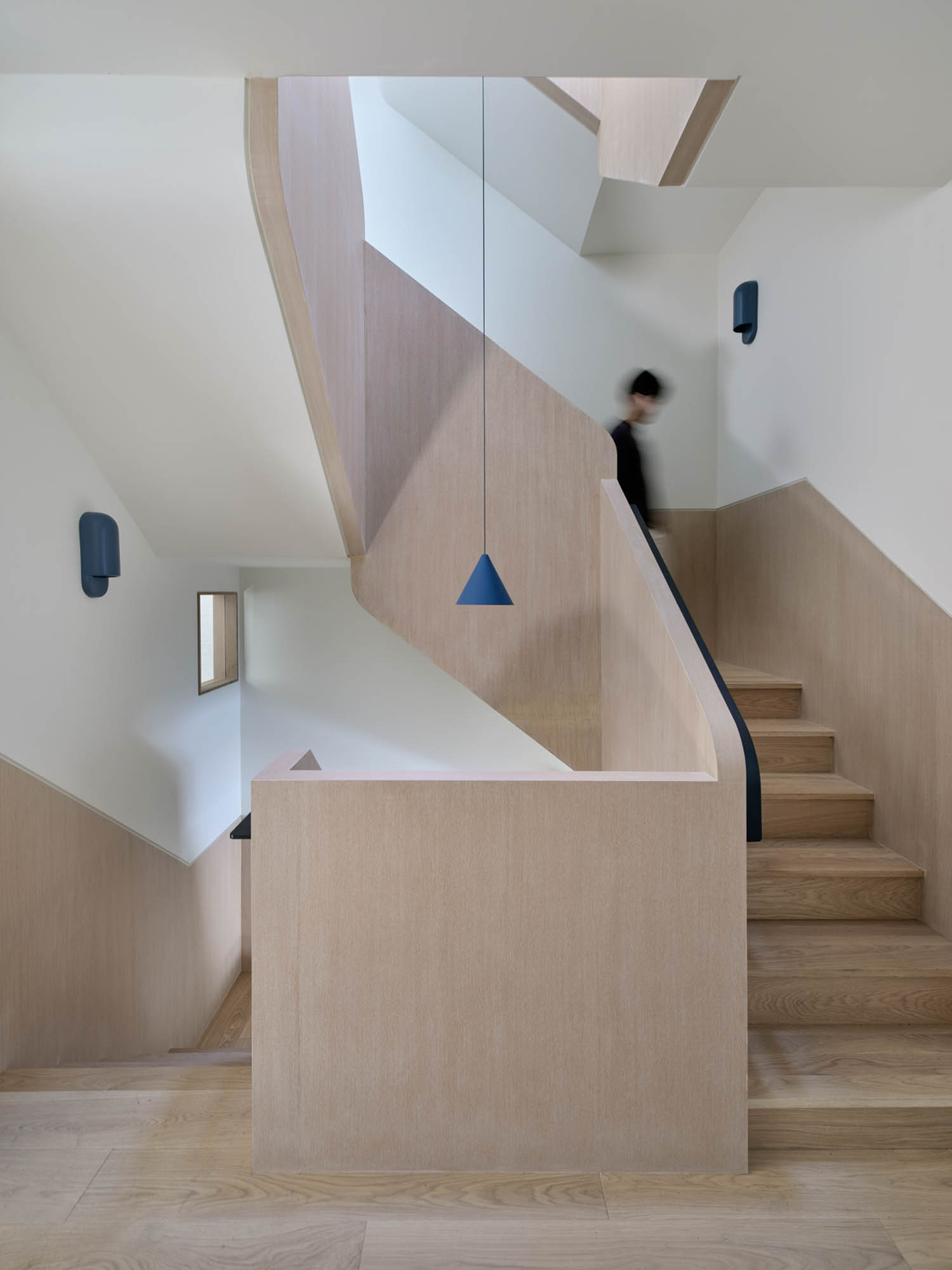 wooden staircase with iron railing