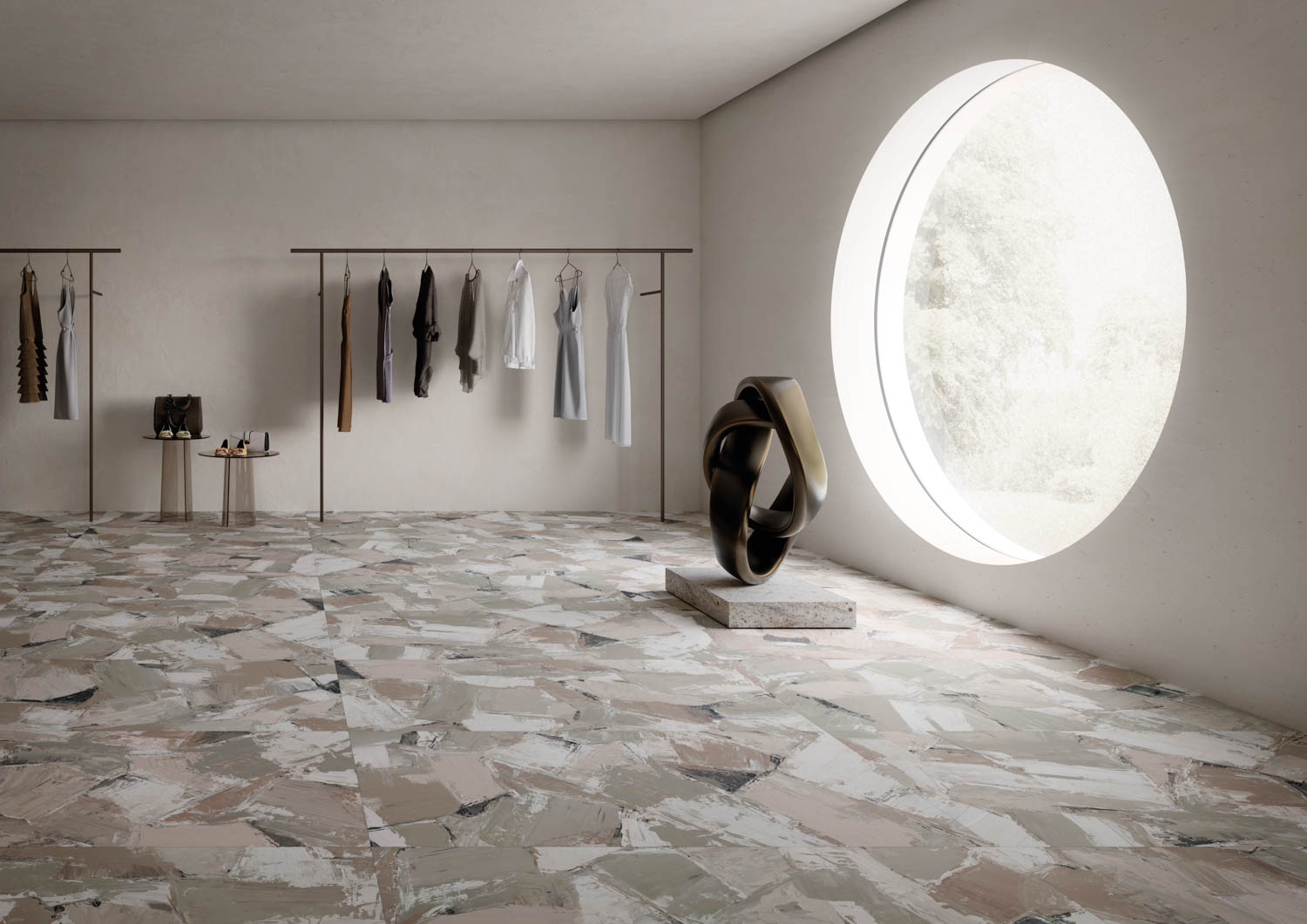 showroom with multiple clothes on rack, tiles and circular window
