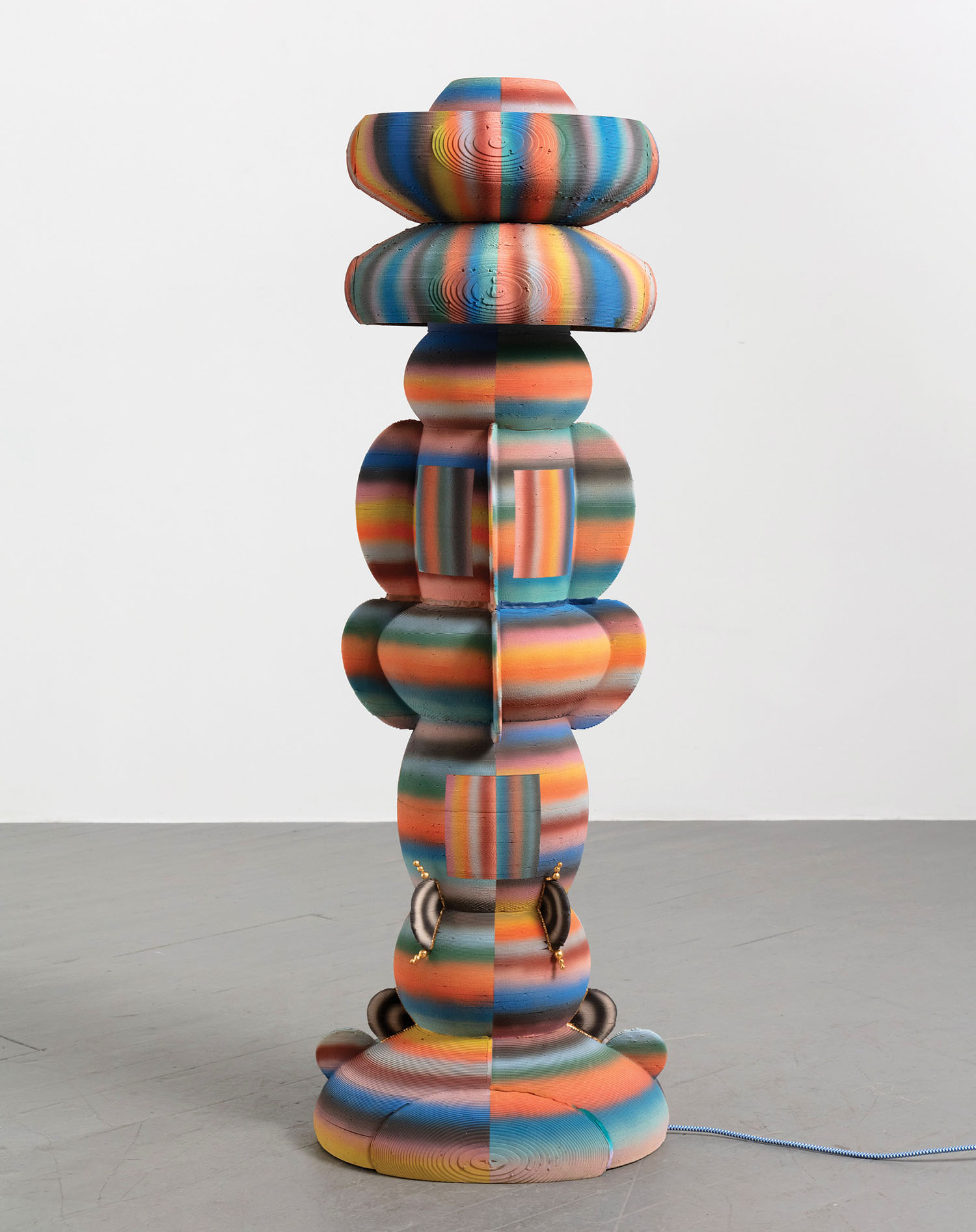 A colorful sculpture with a large pile of paper.