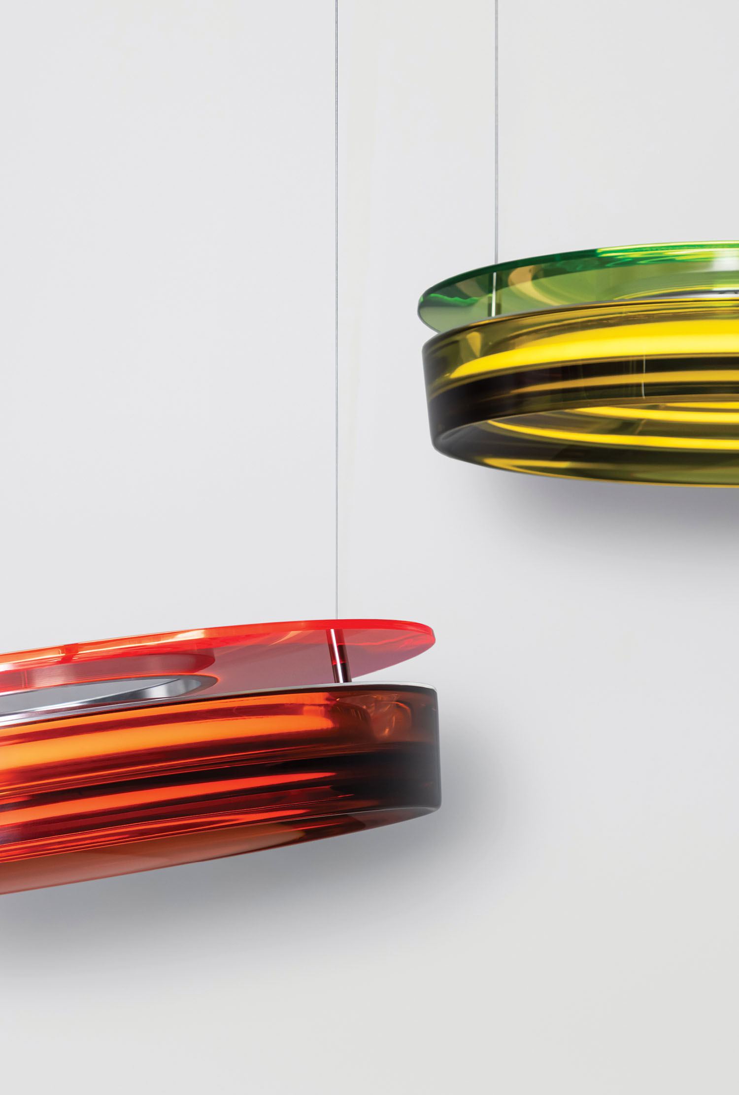 Two colorful glass pendants hanging from the ceiling.