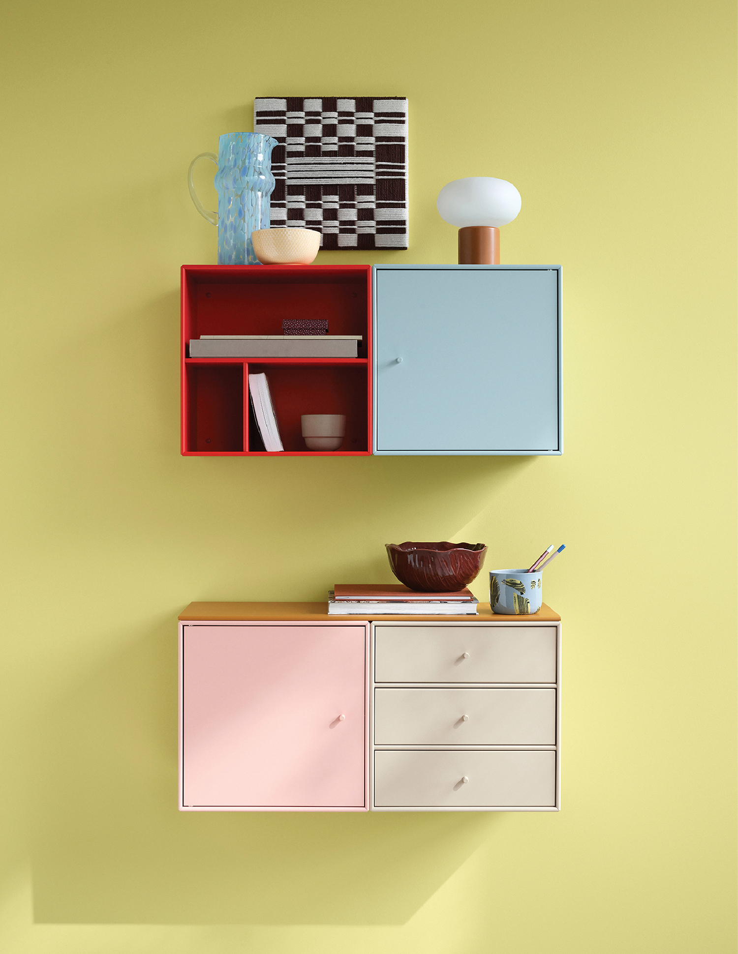 A wall with a shelf and a vase on it.