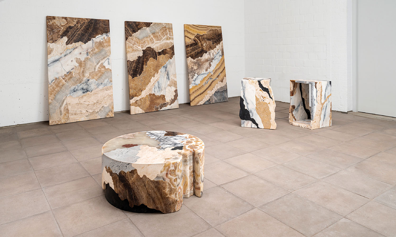 A room with a table and a large painting.