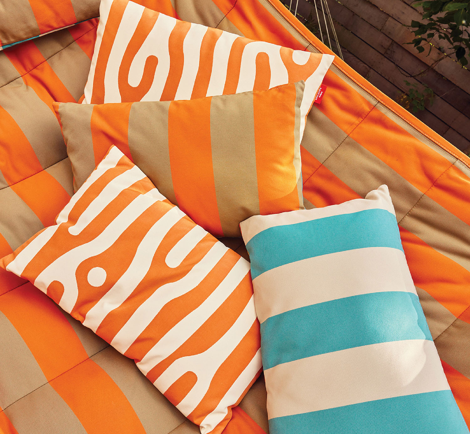 A couple of pillows sitting on a blanket