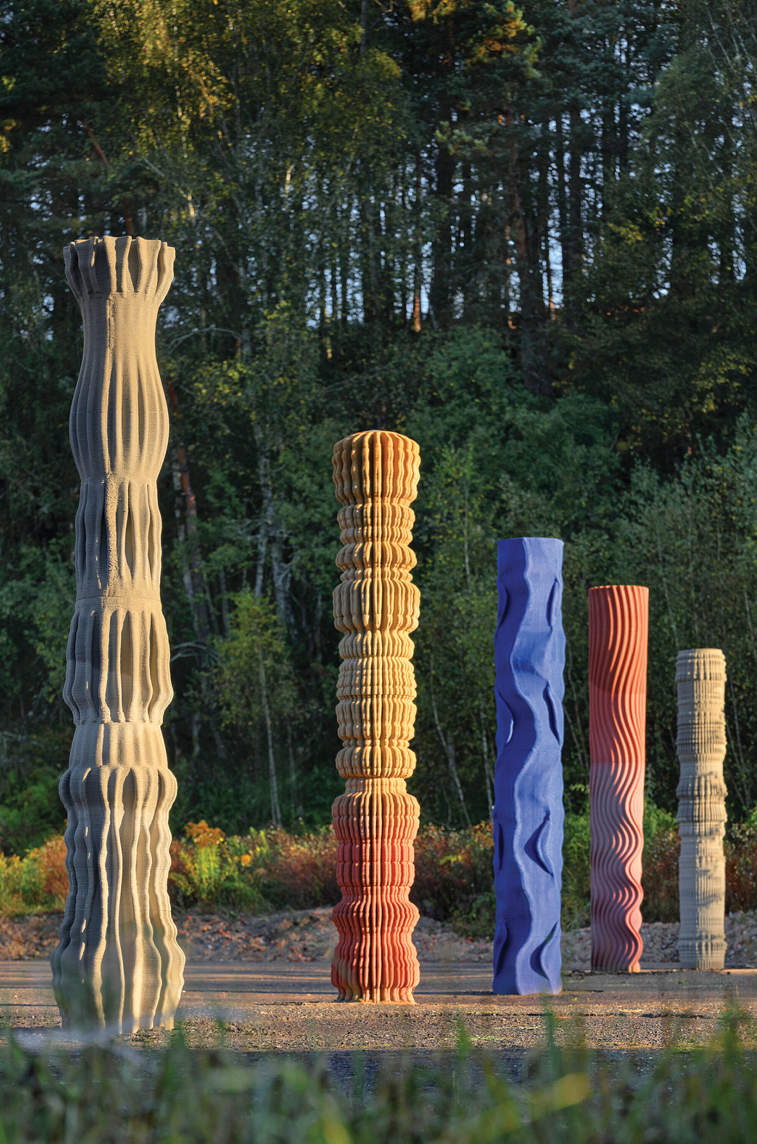A group of tall, colorfully colored sculptures.
