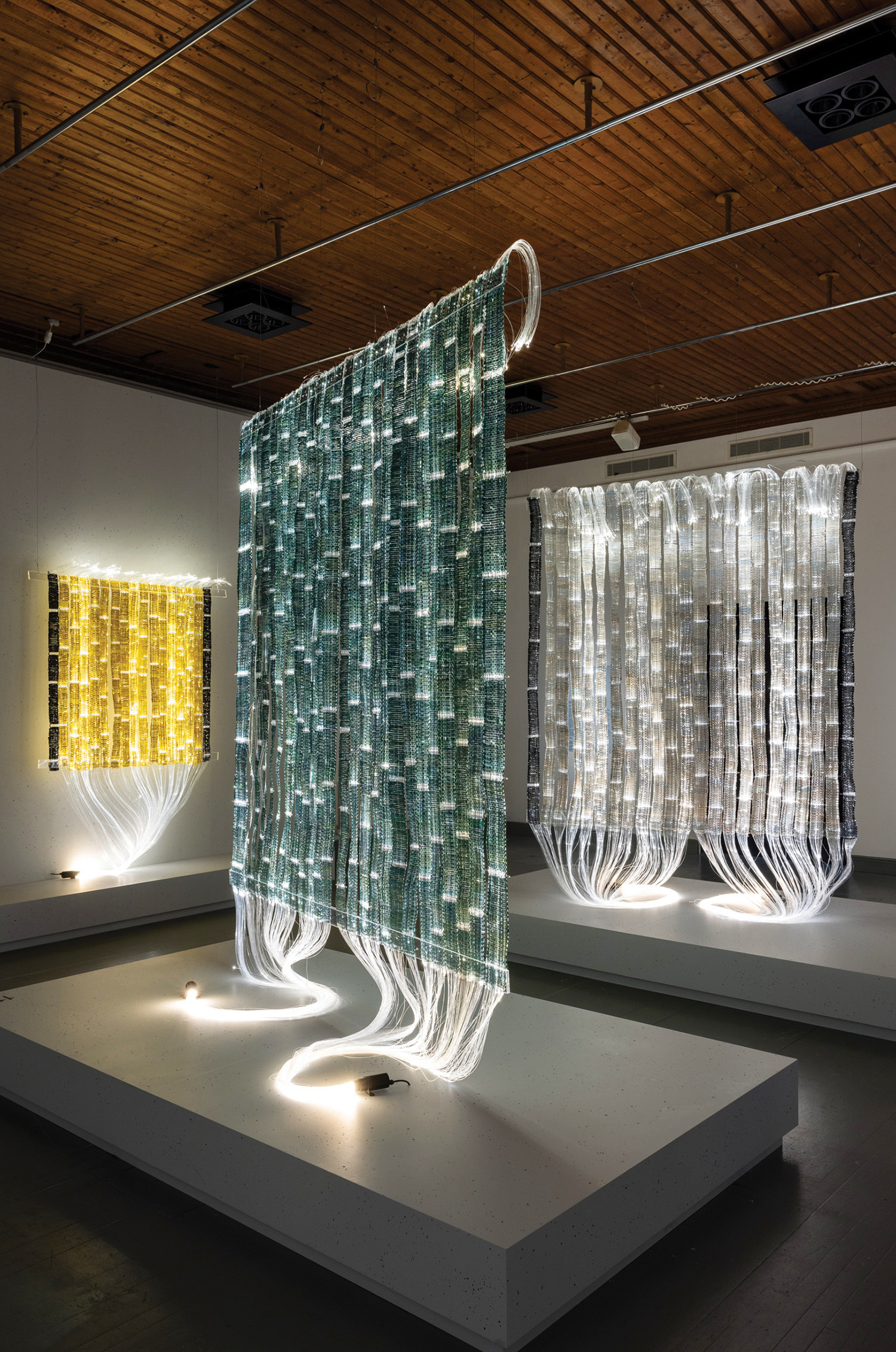 A room with a large display of glass and metal.