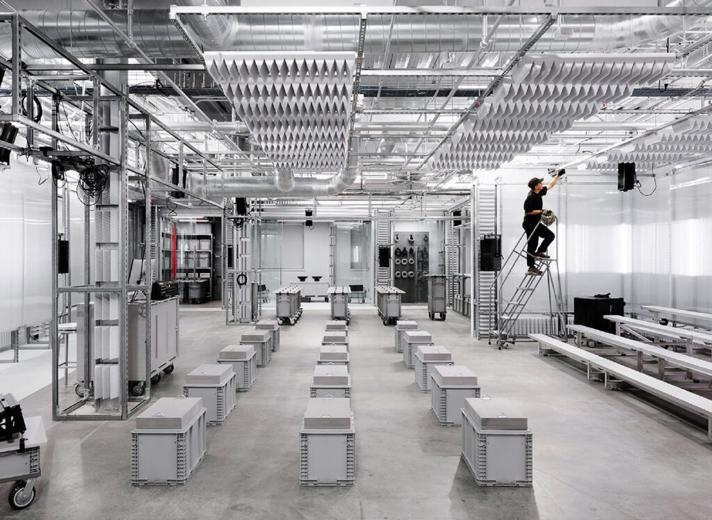 A man is standing on a ladder in a room.