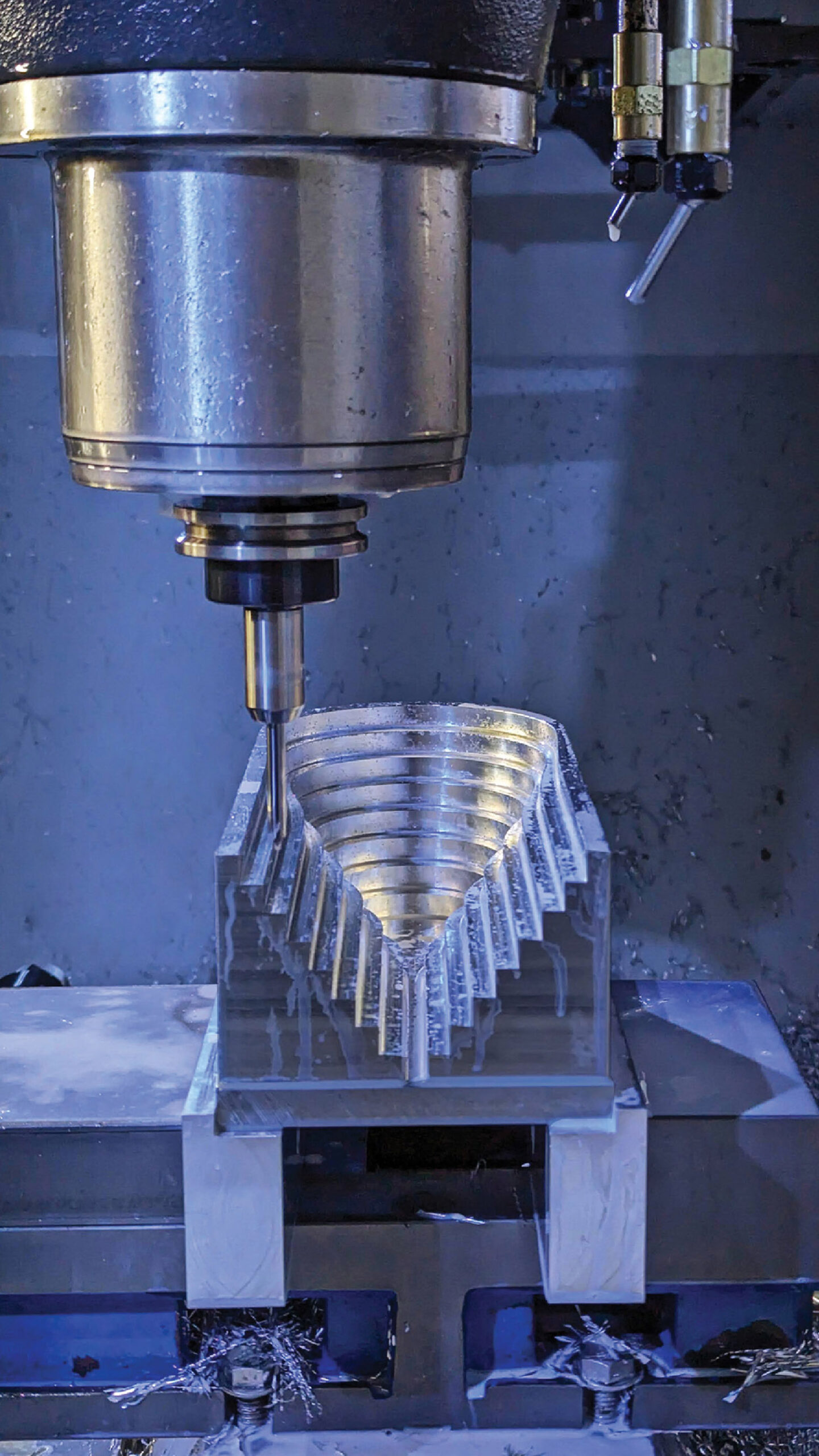 A machine cutting a piece of metal.