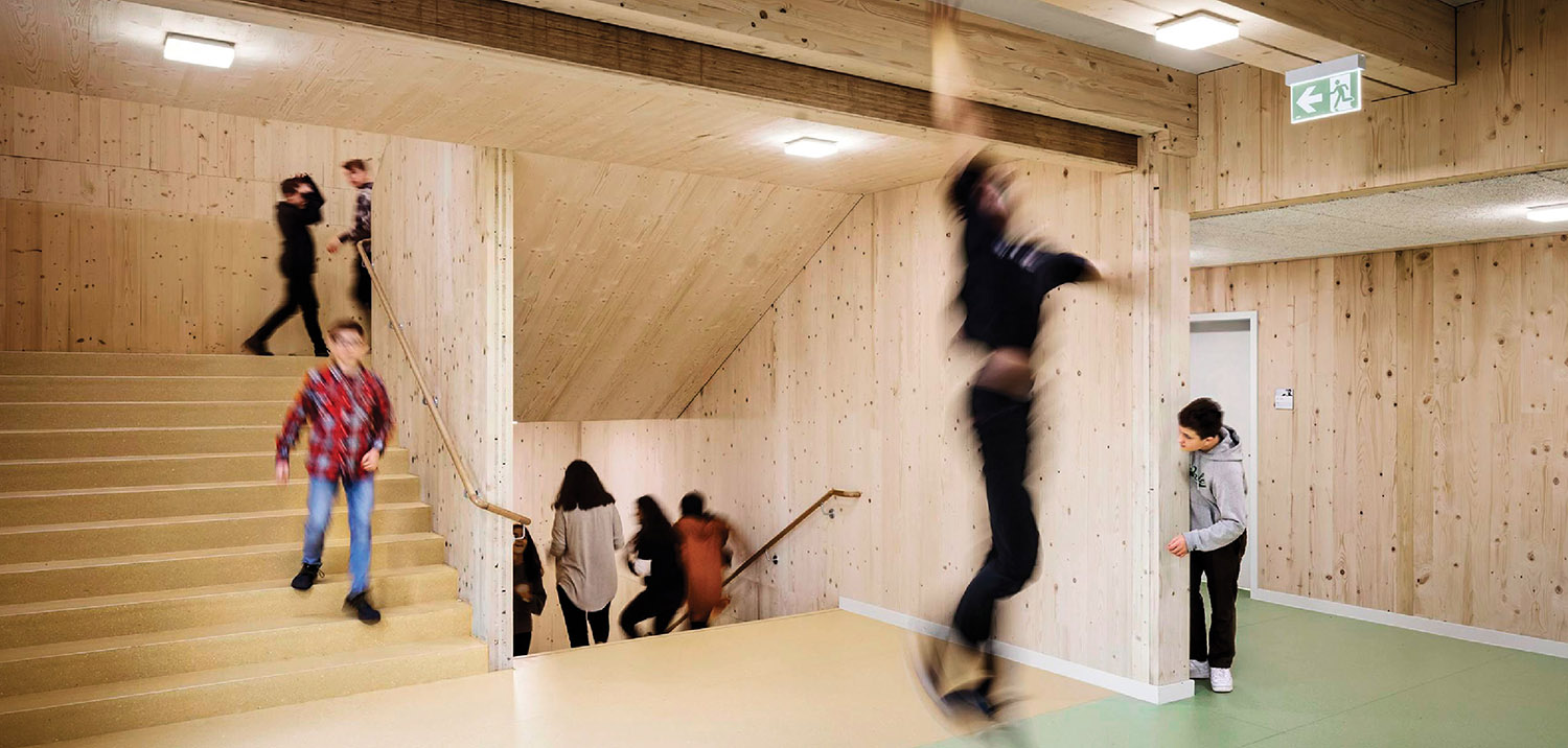 A group of people are walking up some stairs.