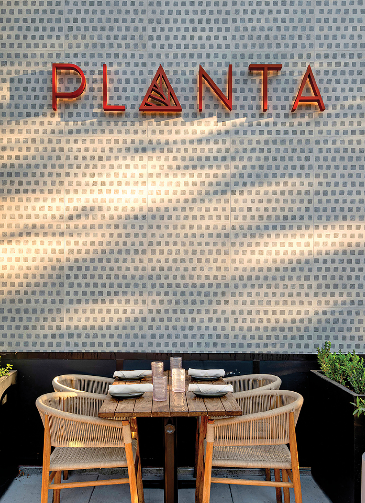 A table and chairs outside a restaurant.