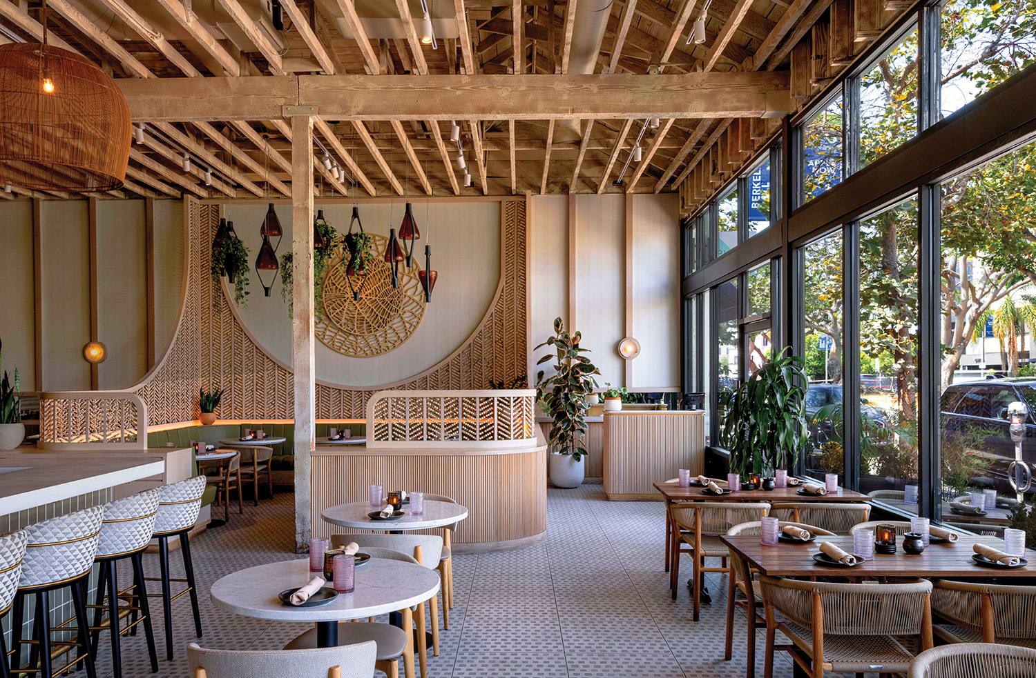 A restaurant with a bar and tables.