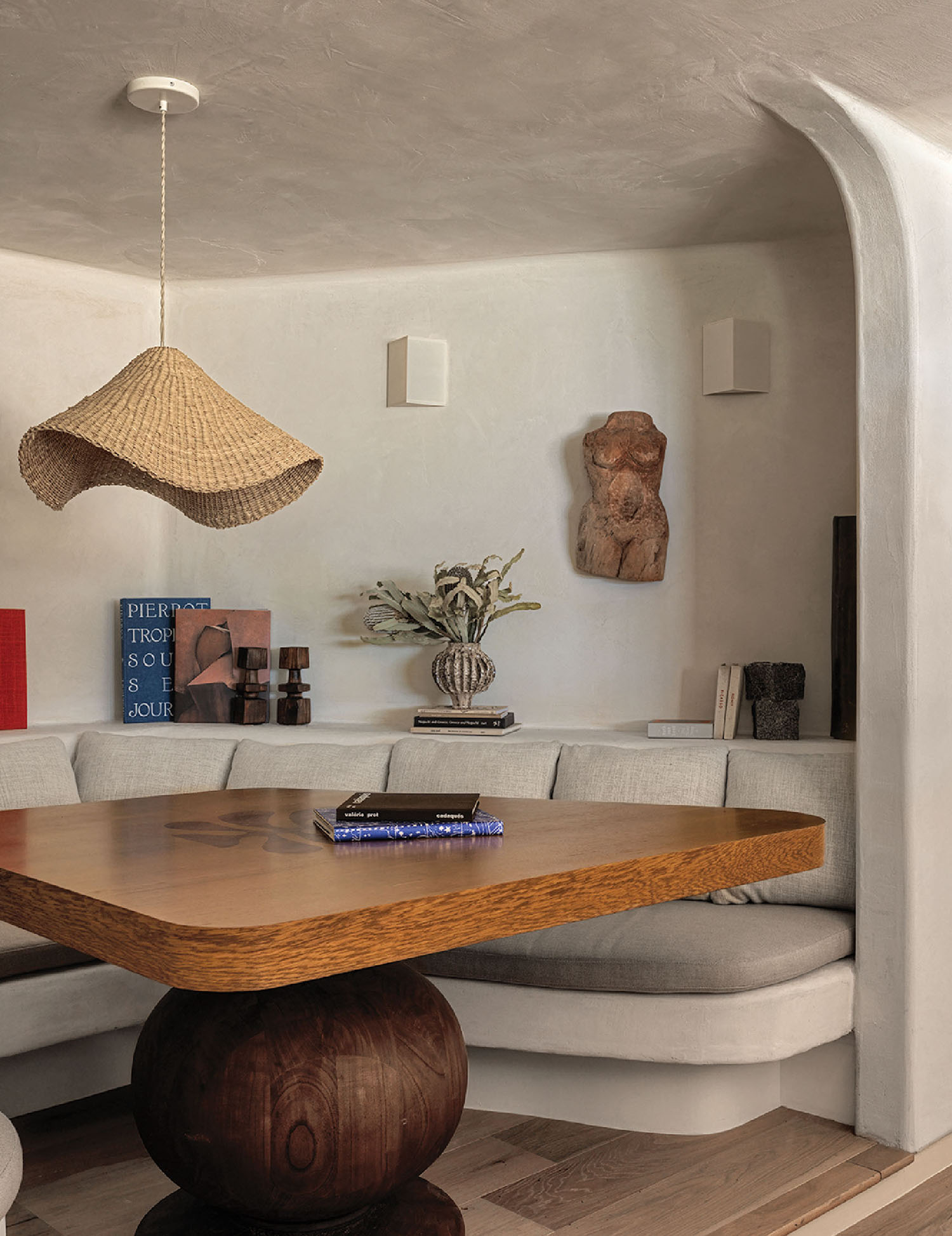 A living room with a couch and a table.