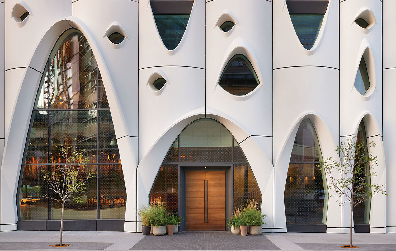 The facade of the building is made of white and black.