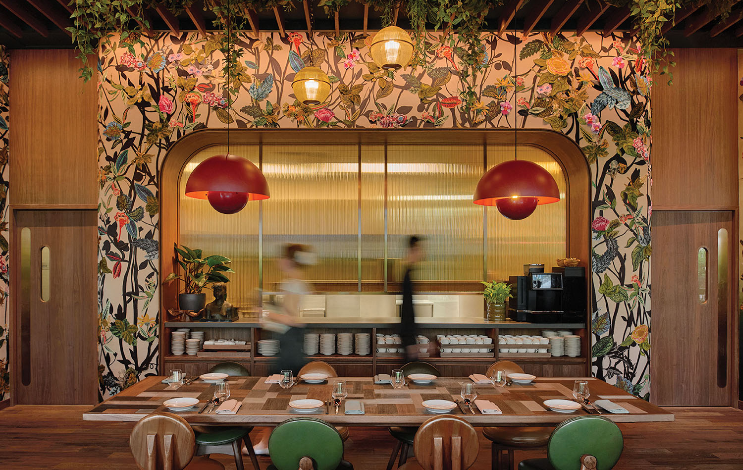 A restaurant with a large mural of flowers.
