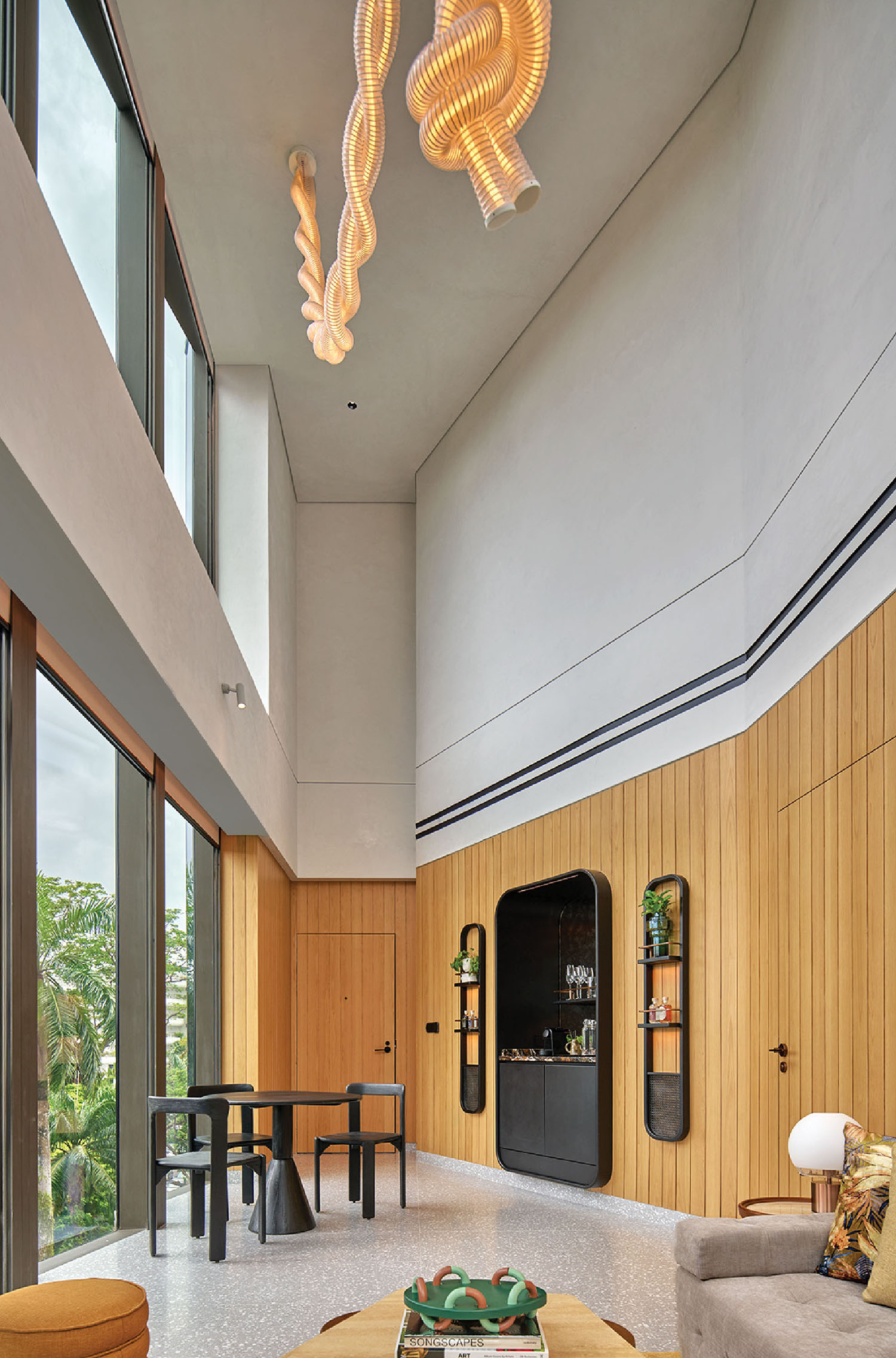 A living room with a large wooden ceiling.
