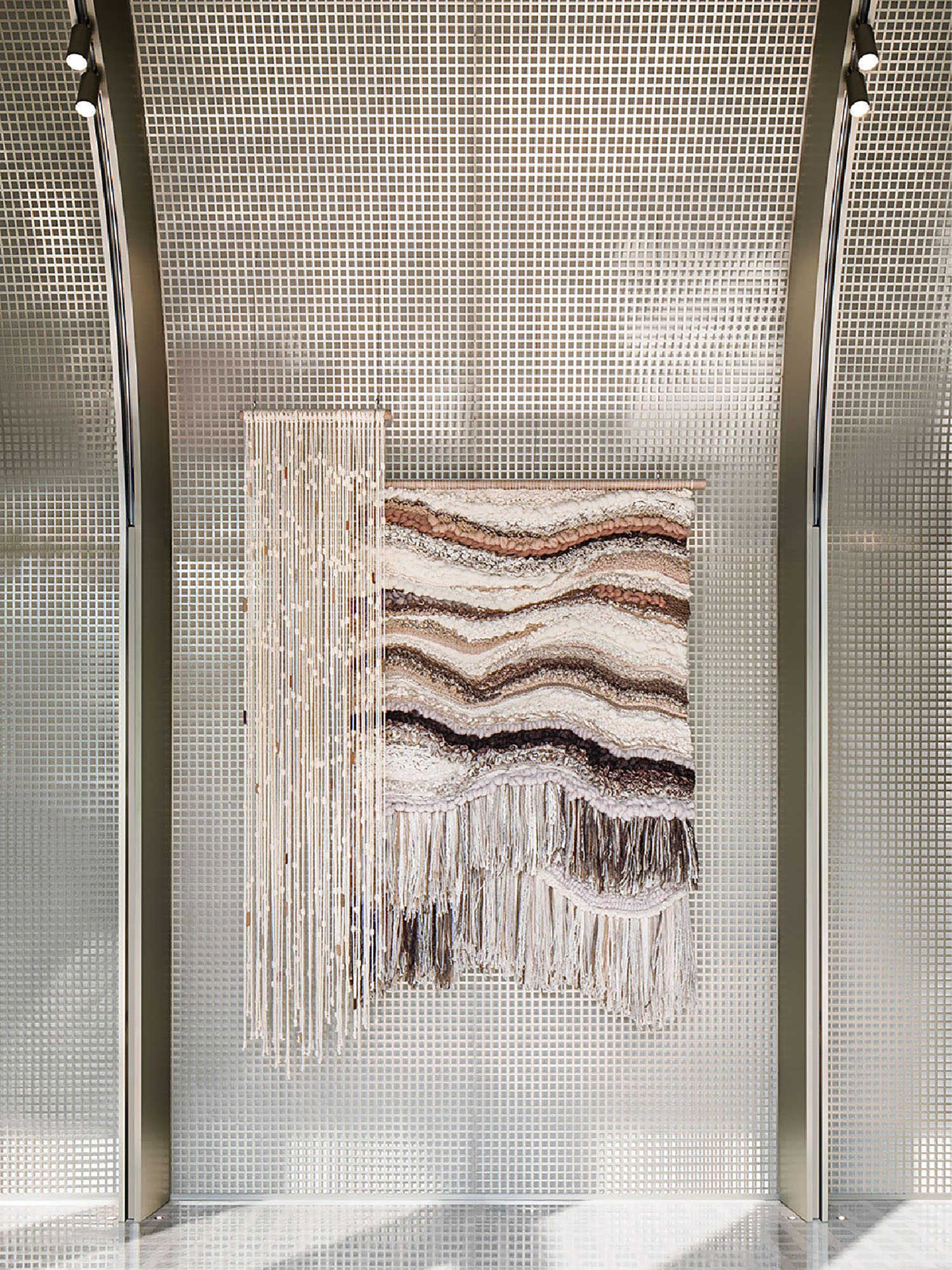 A large piece of art hanging on a wall.