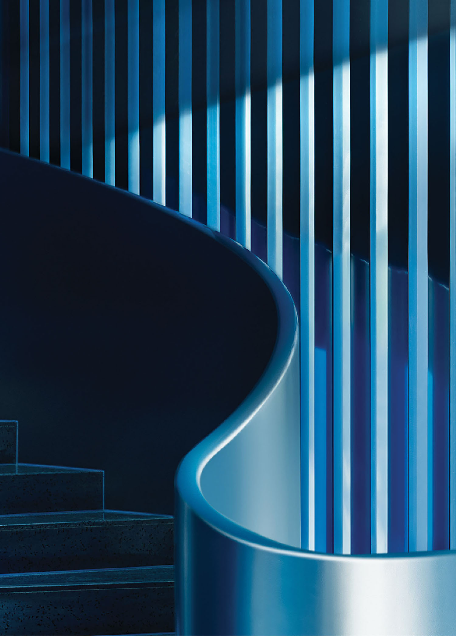 A blue staircase with a metal railing.
