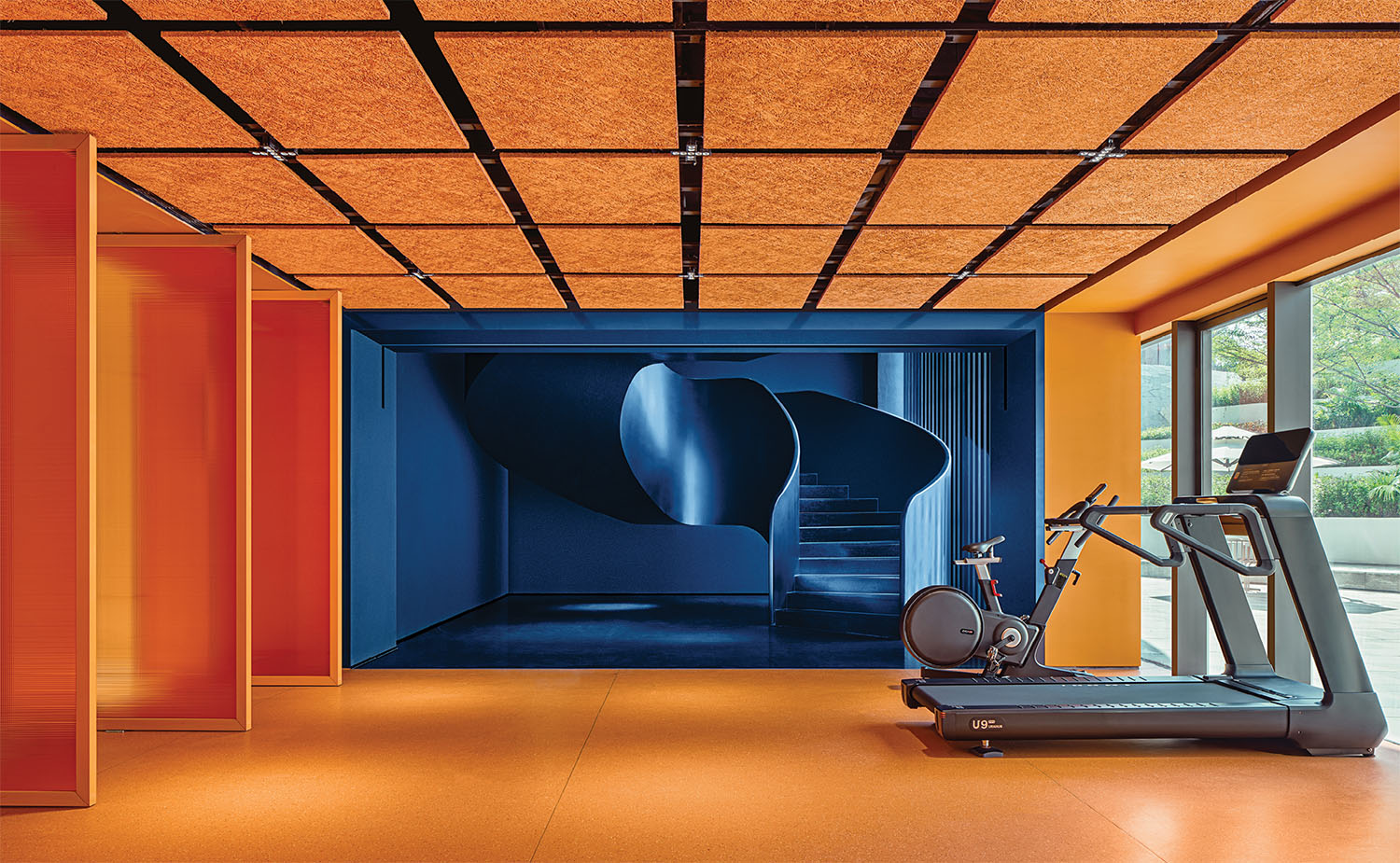 A gym room with a tread treadmill.