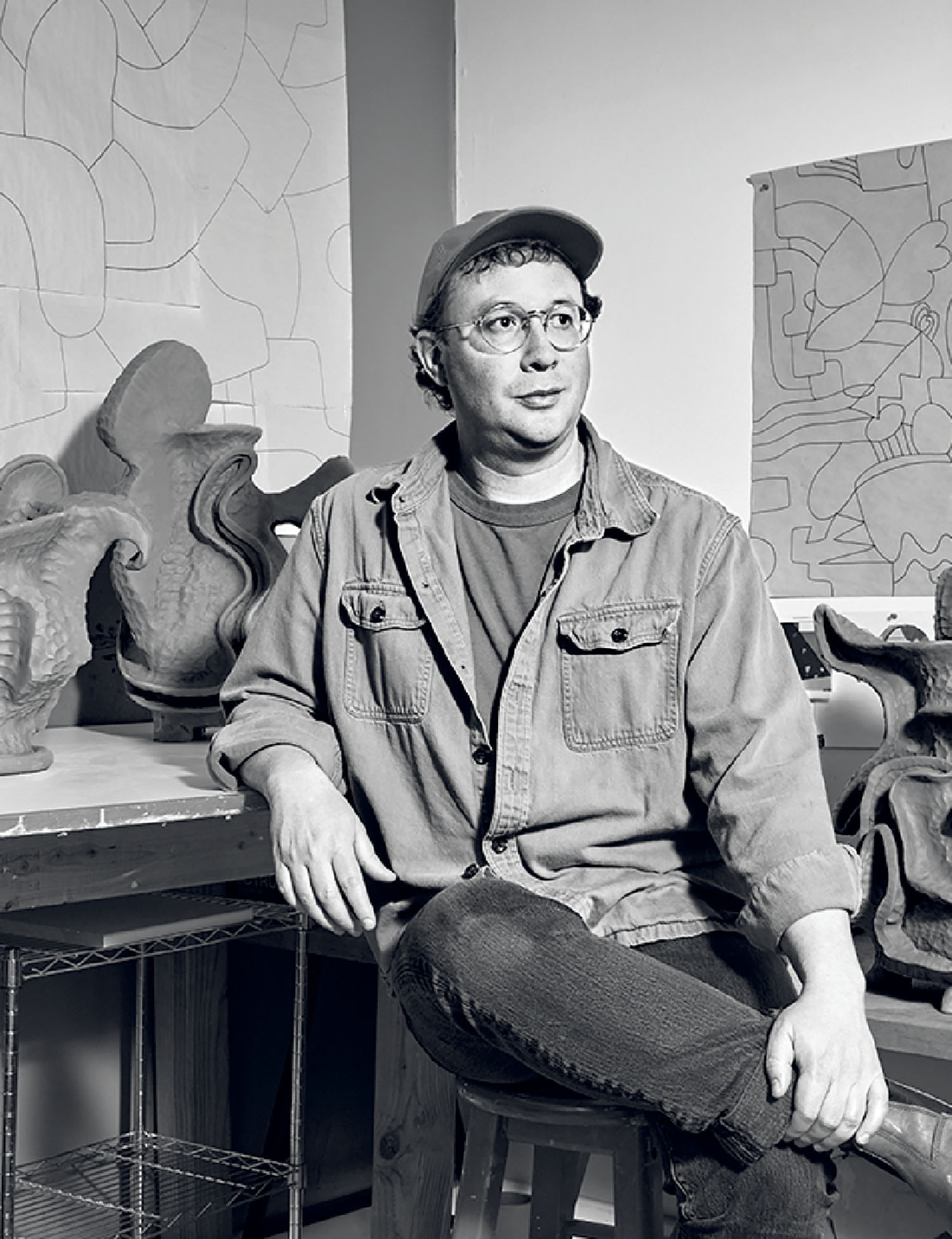 A man sitting on a stool.