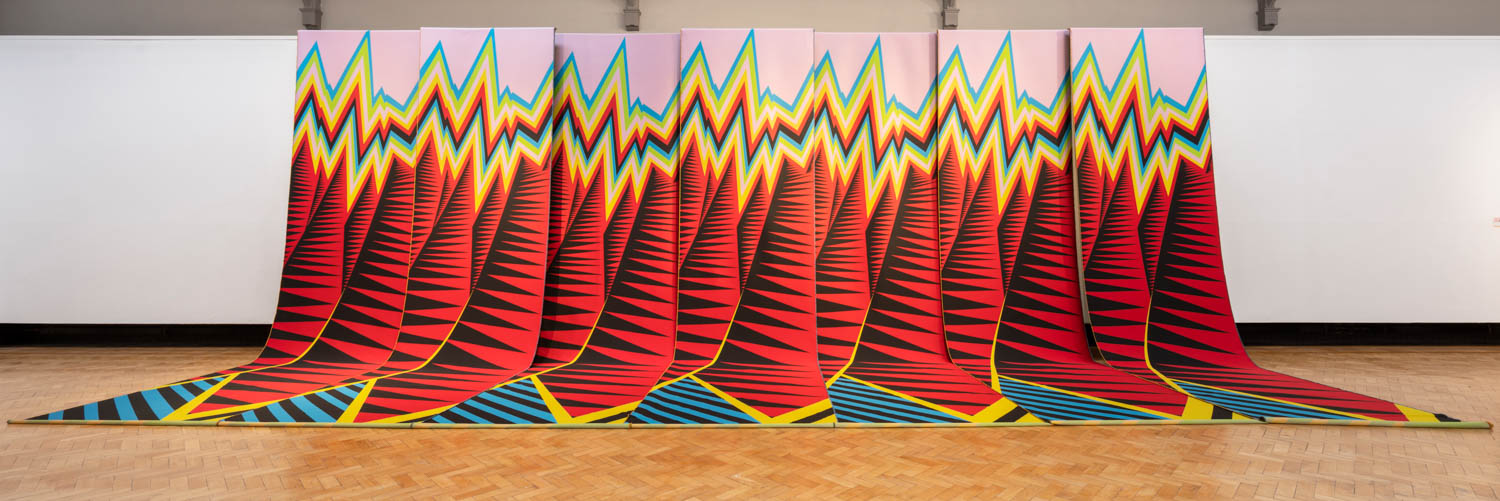 portrait of multiple red mountains in a row
