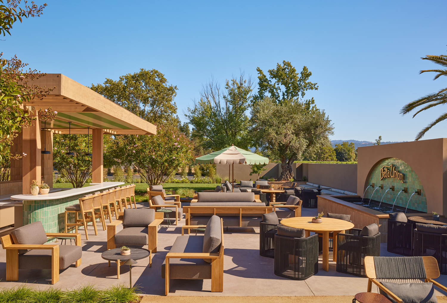 outdoor courtyard of winery with lots of seating and view of the landscape