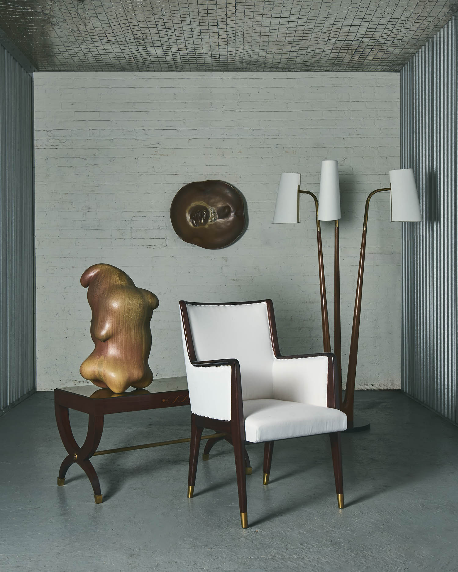 art piece on table next to white chair