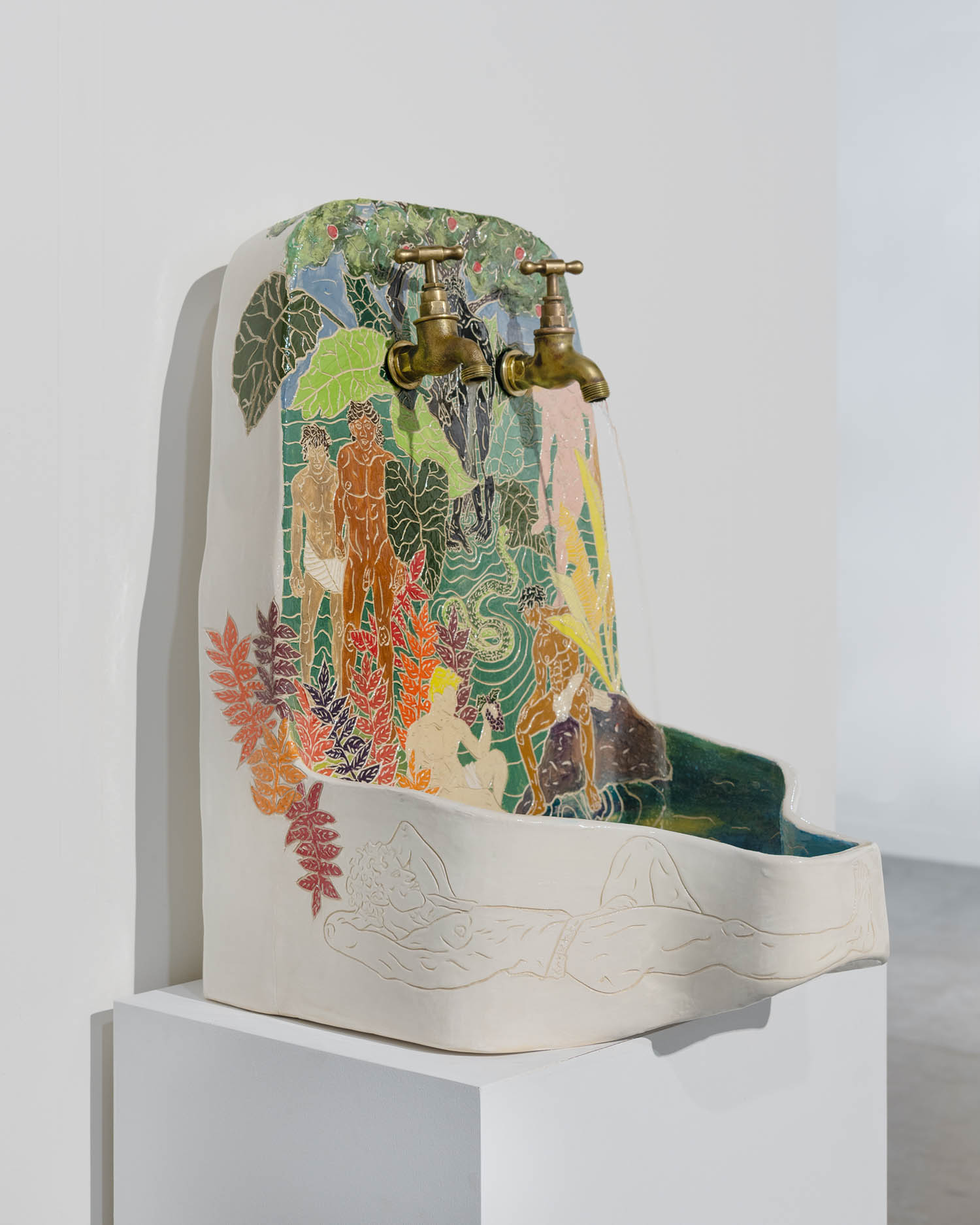 urinal made of glazed ceramic and brass taps