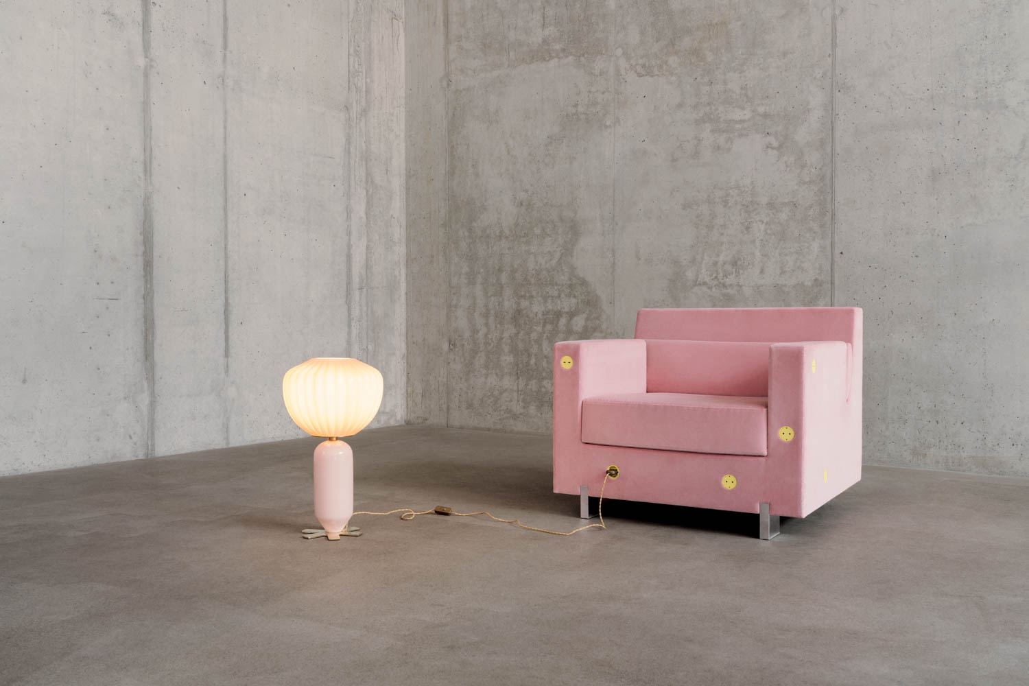 light pink chair next to a lamp