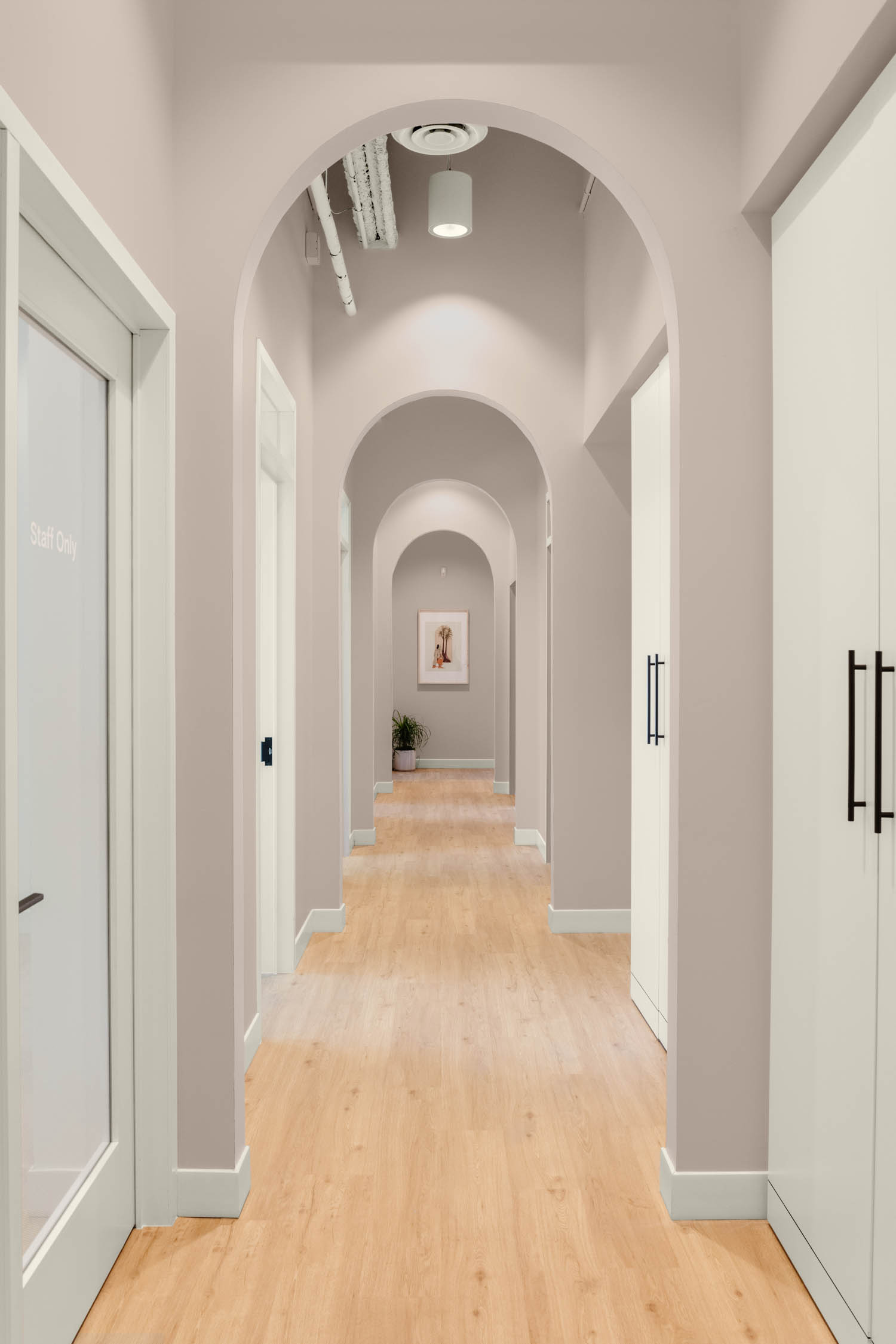long hallway with arched entryway