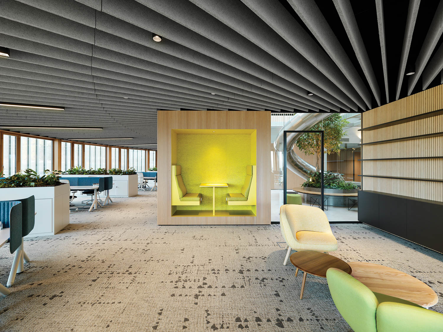 room with brown carpeting, yellow booth and slatted roof