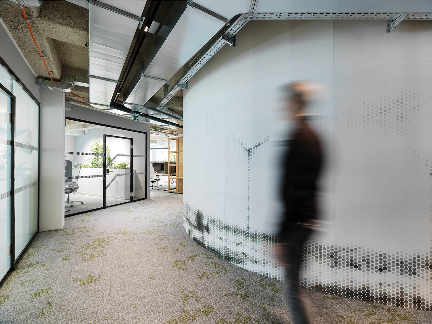 person walking through a hallway