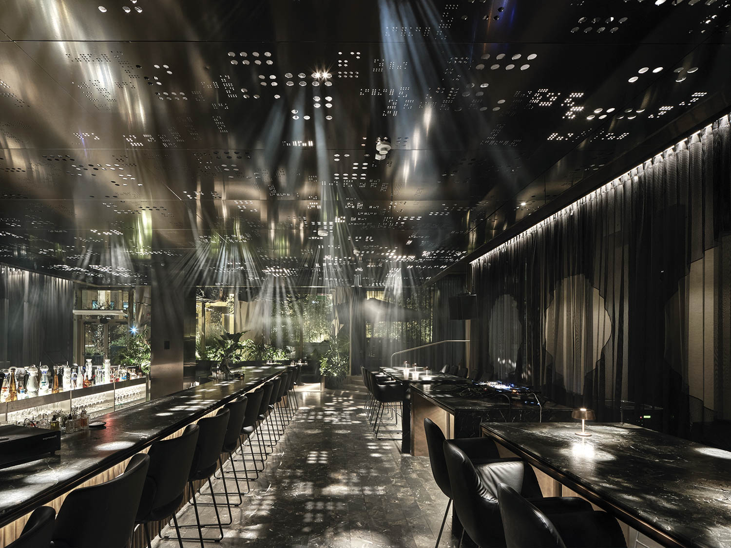 restaurant with dim lighting and long bar