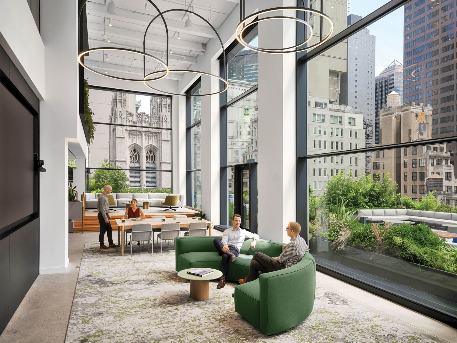 two people sitting at the green chairs
