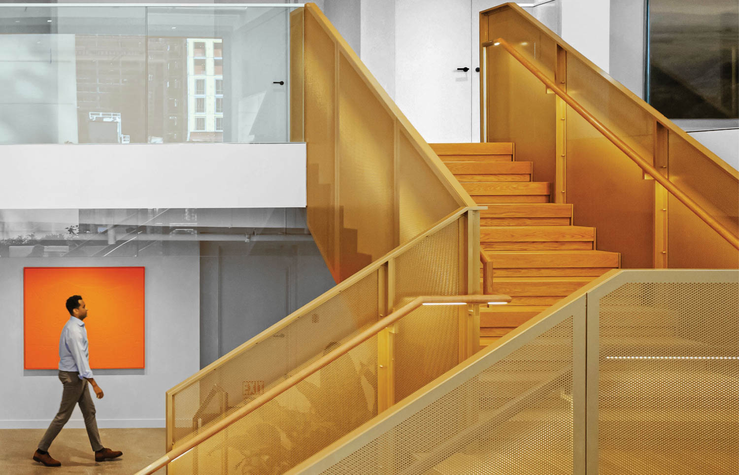man walking by a set of stairs