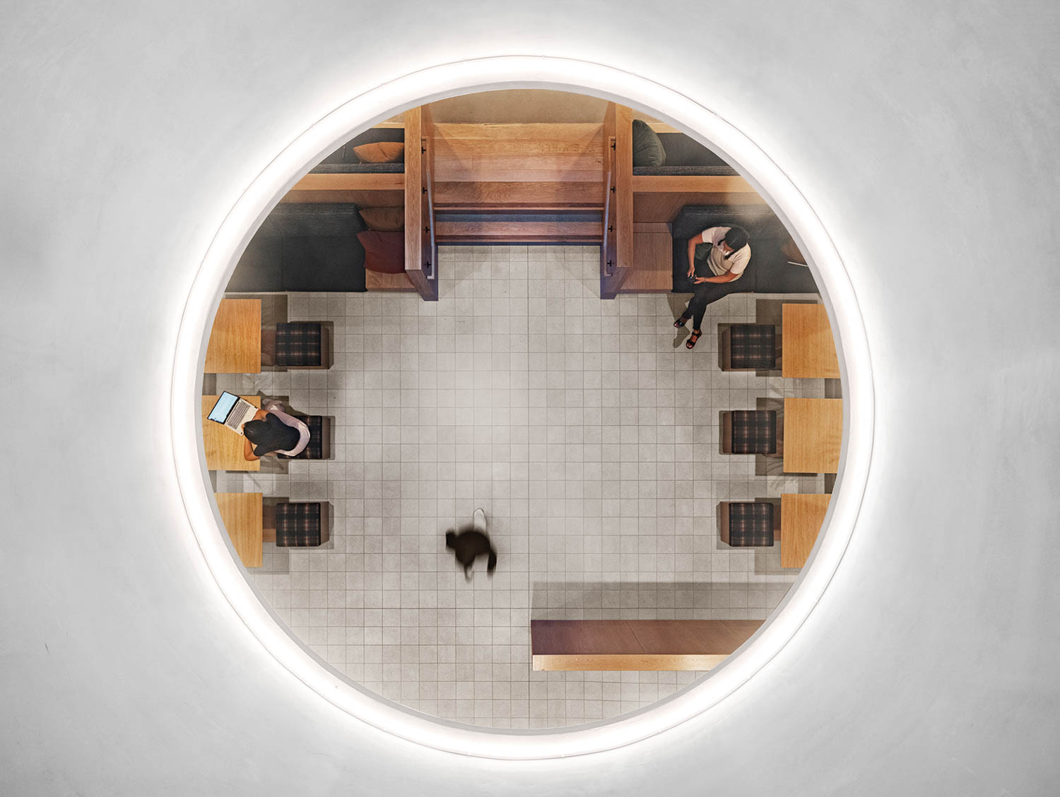 view of students working through circular window
