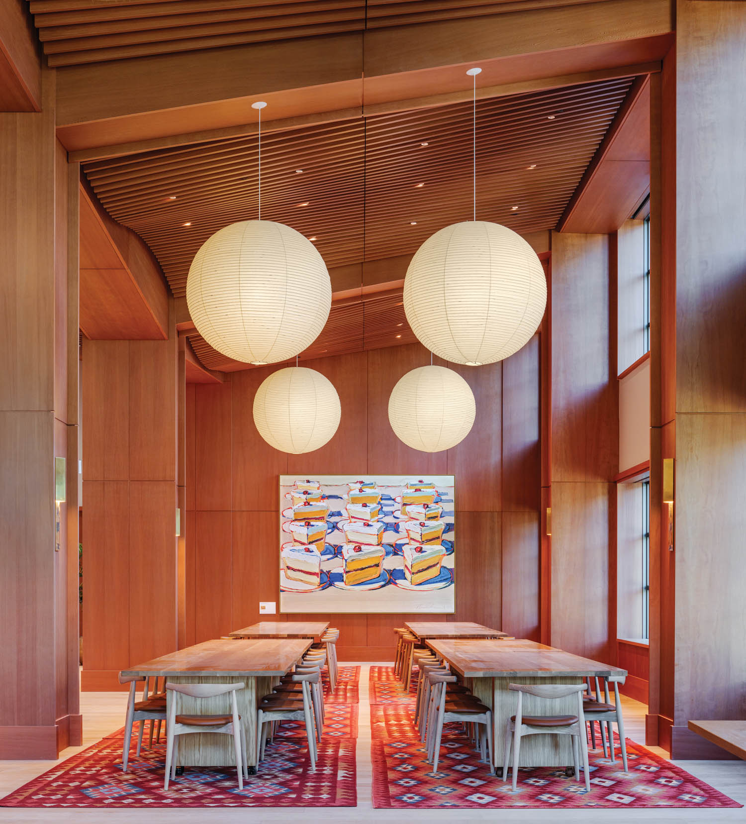 study area with wood walls and circular pendants