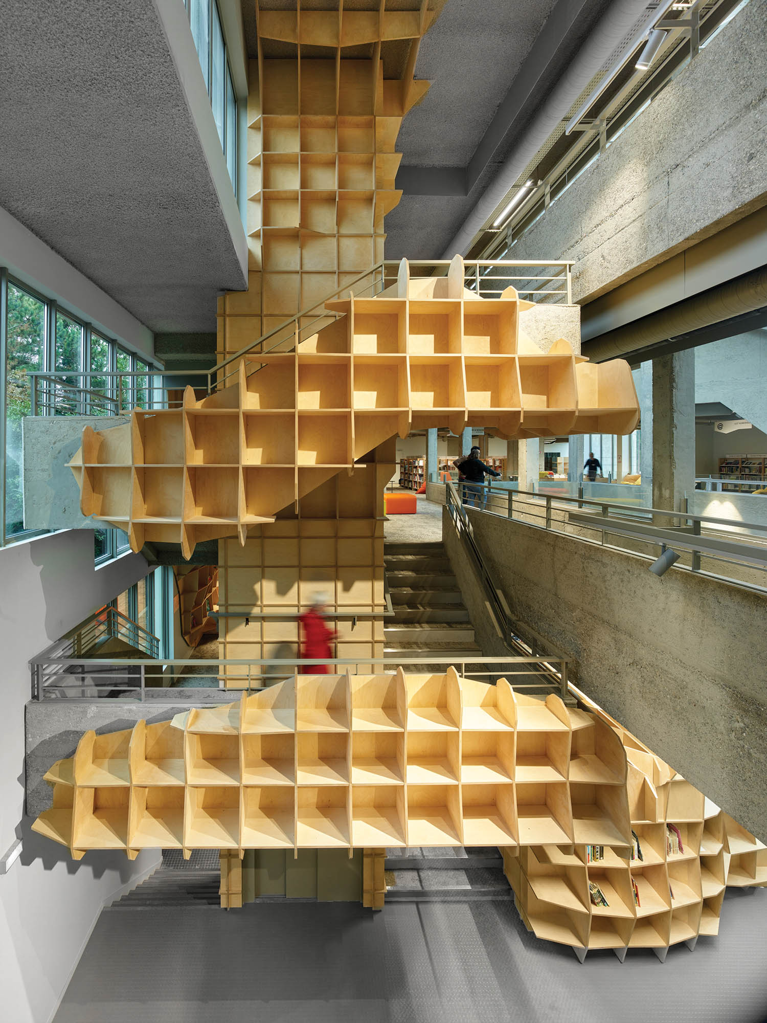 cubby holes along a staircase that look like waffles