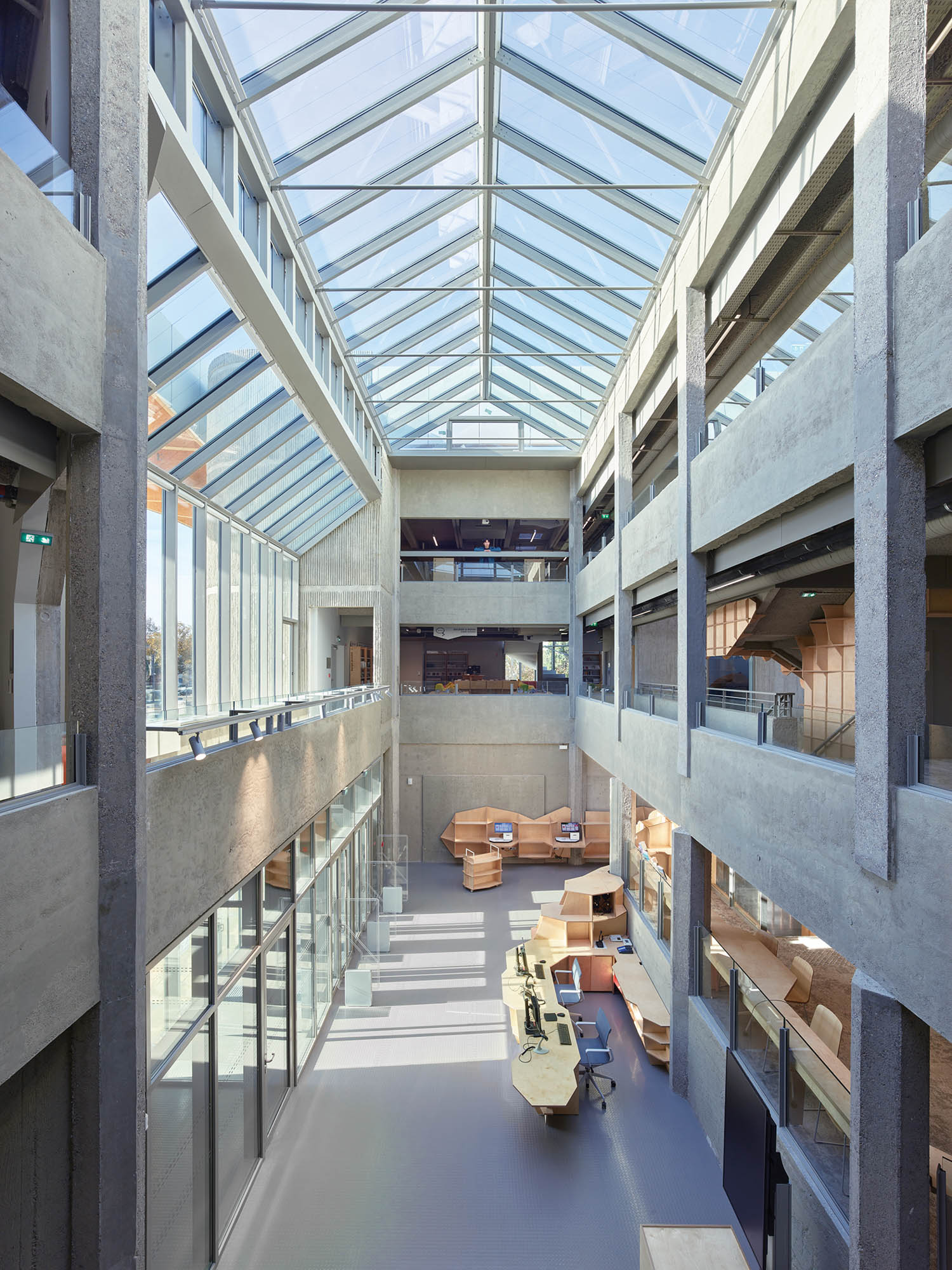 view of the room from the second floor with pointed glass roof