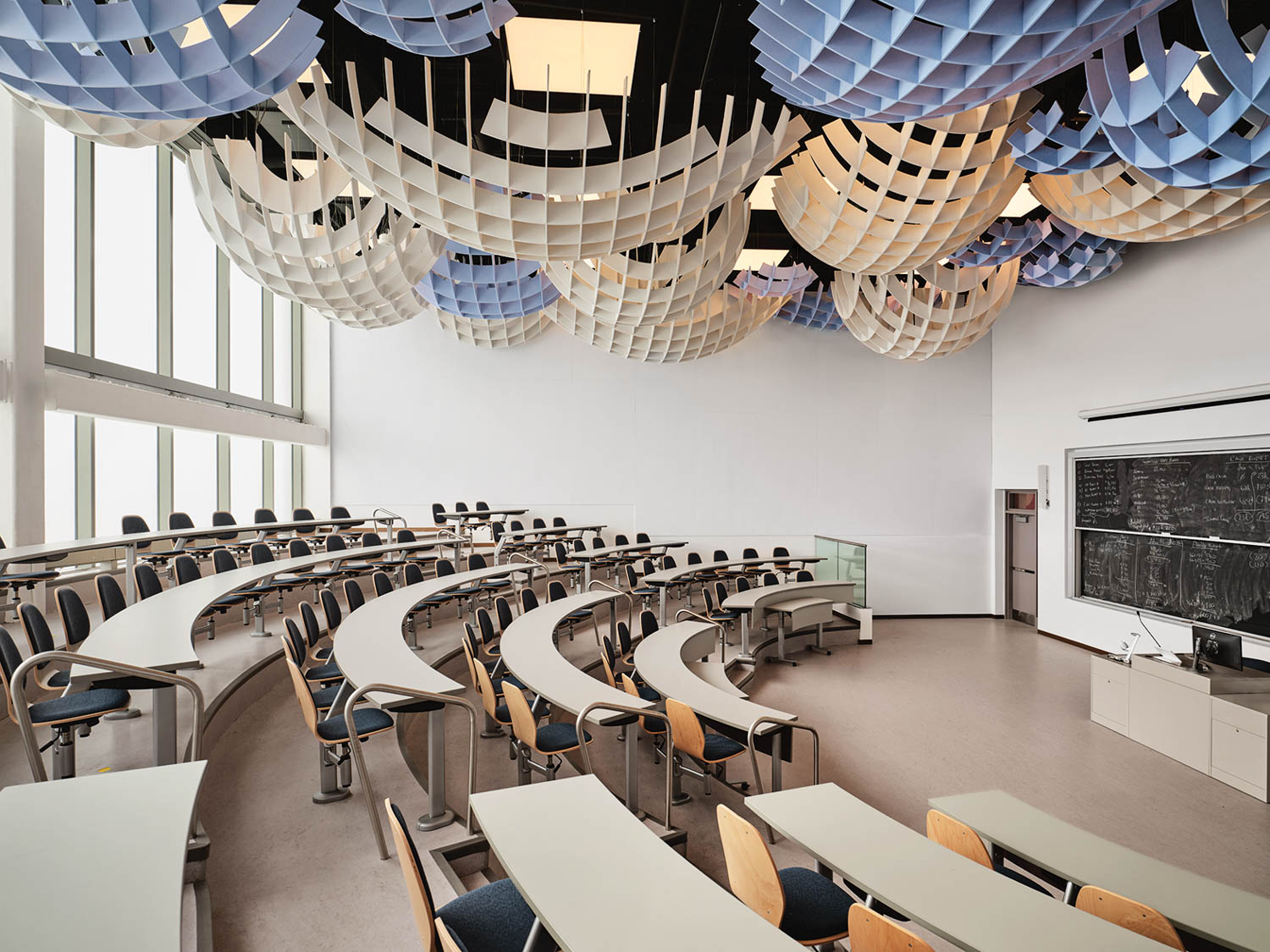 conference room with curved benches and gridded installation