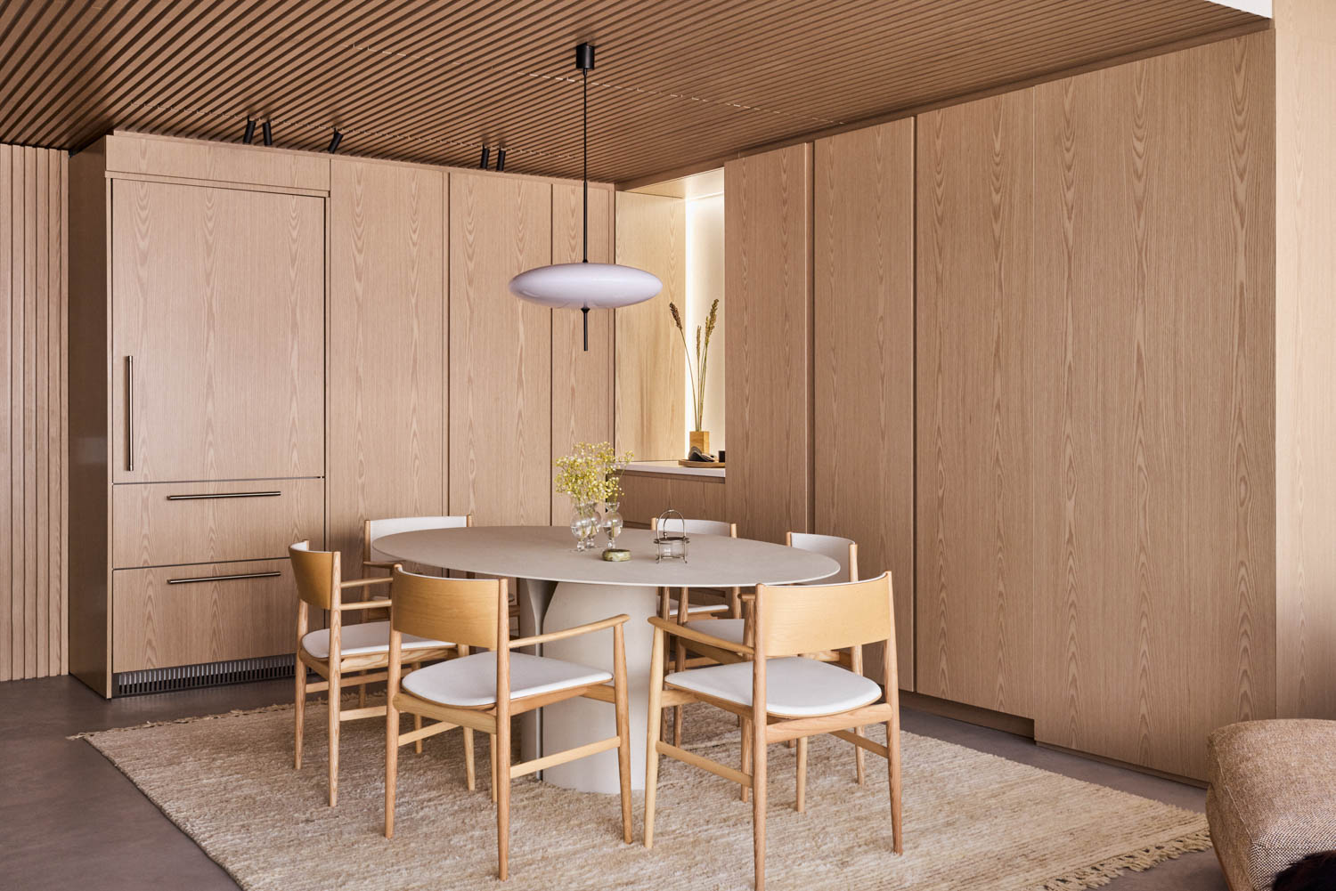dining area with wooden chairs and cabinets