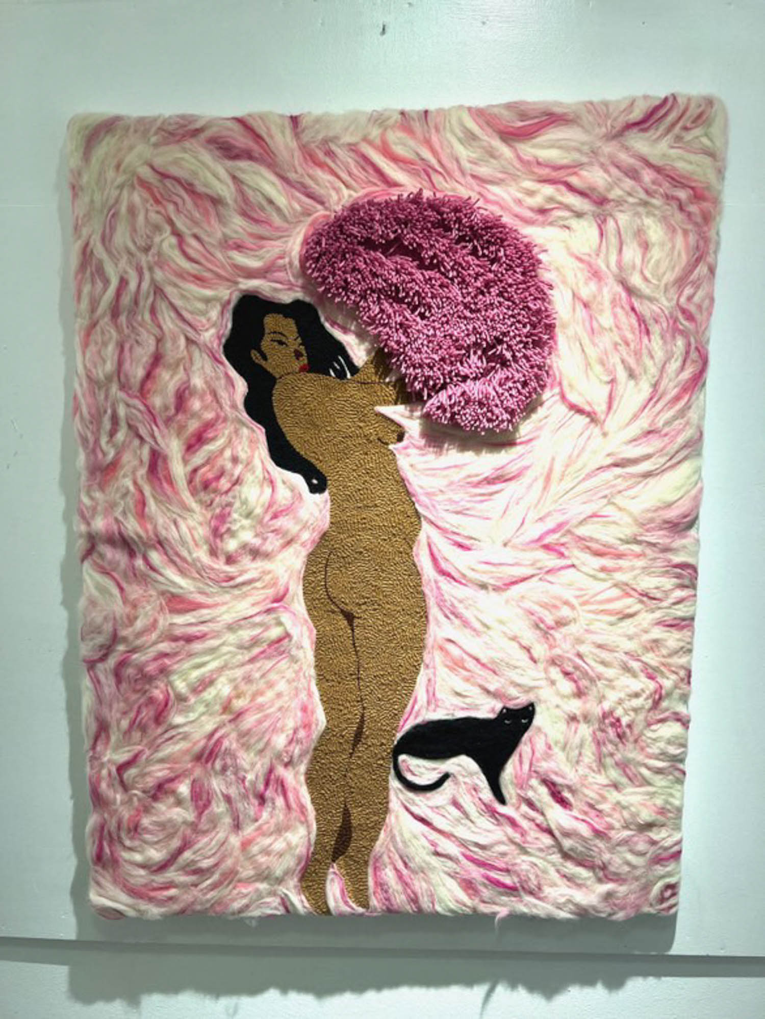 nude woman tufted on a blanket