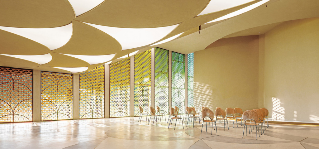 room with tall ceiling and stain glass windows