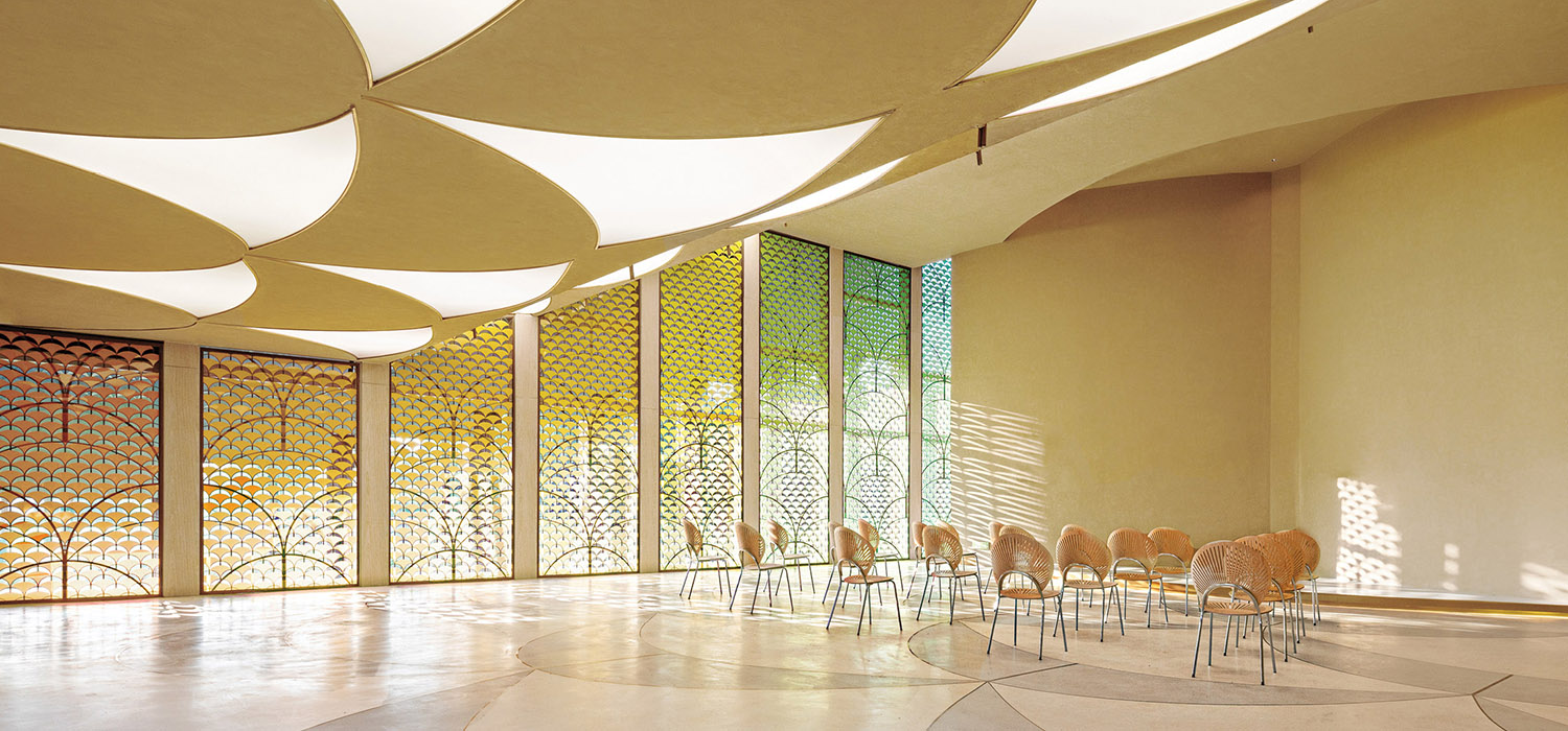 room with tall ceiling and stain glass windows